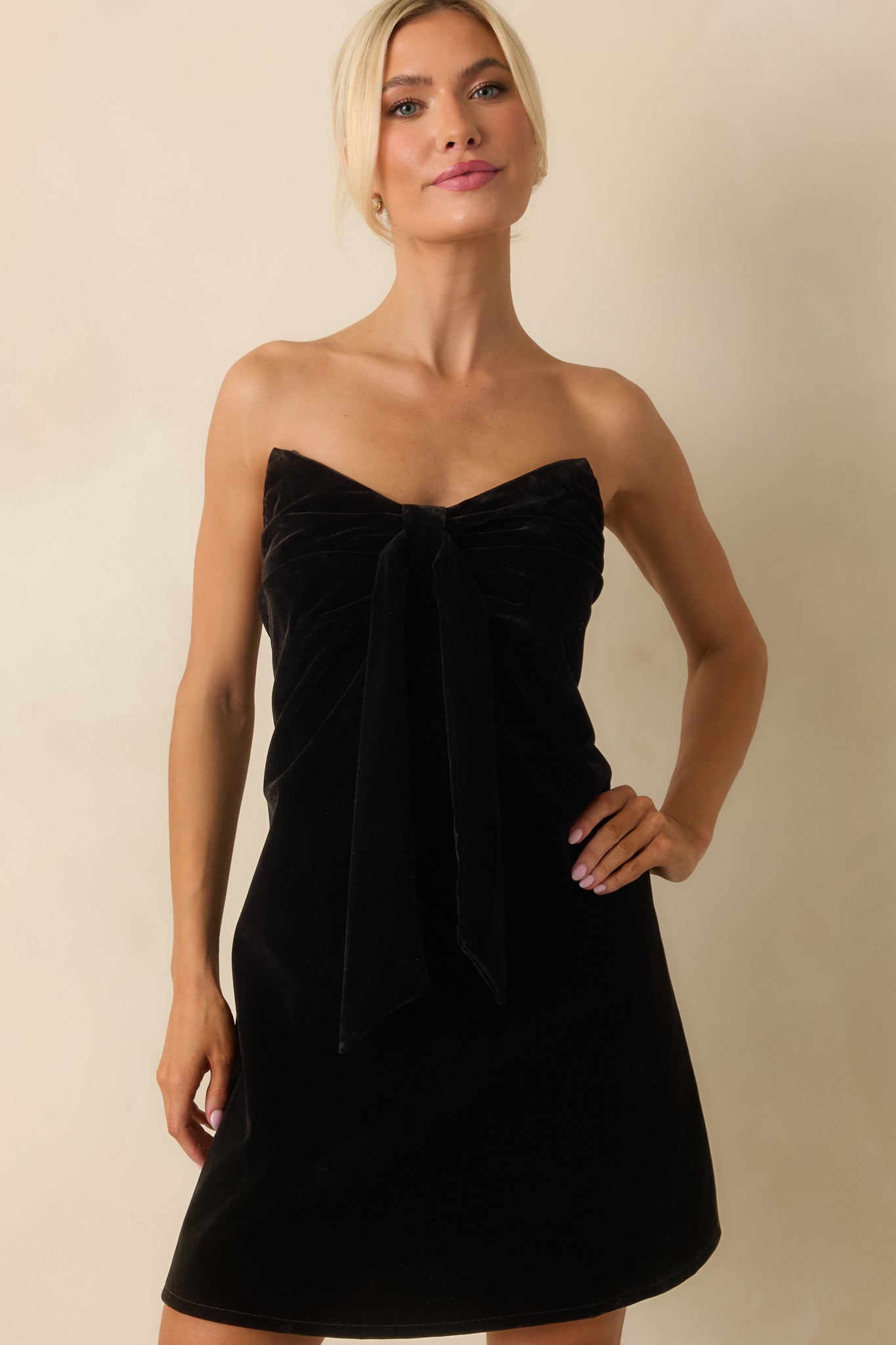 Cropped detail emphasizing the sweetheart neckline and draped front panel.