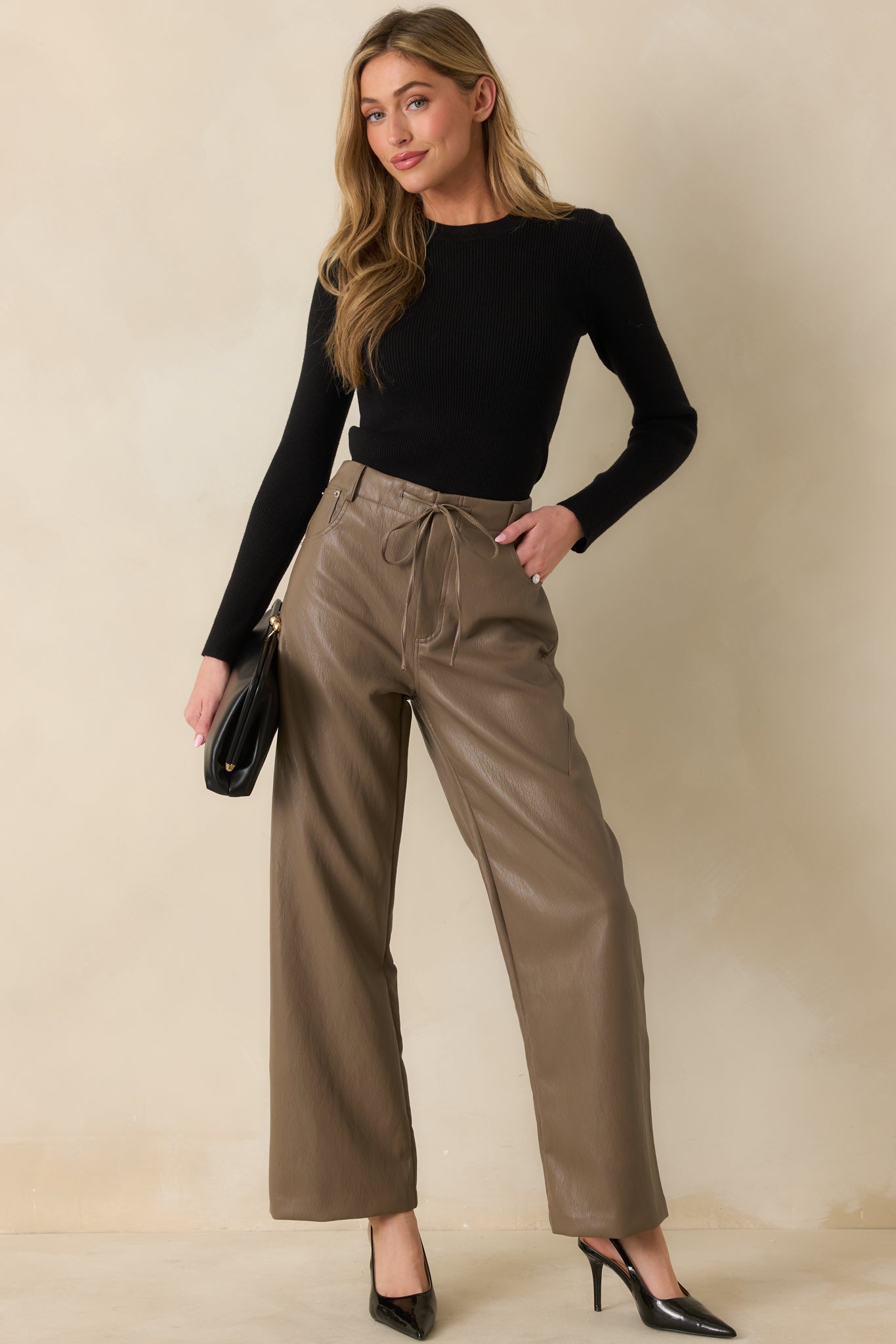 Full body of ribbed sweater with a crew neckline and long sleeves.