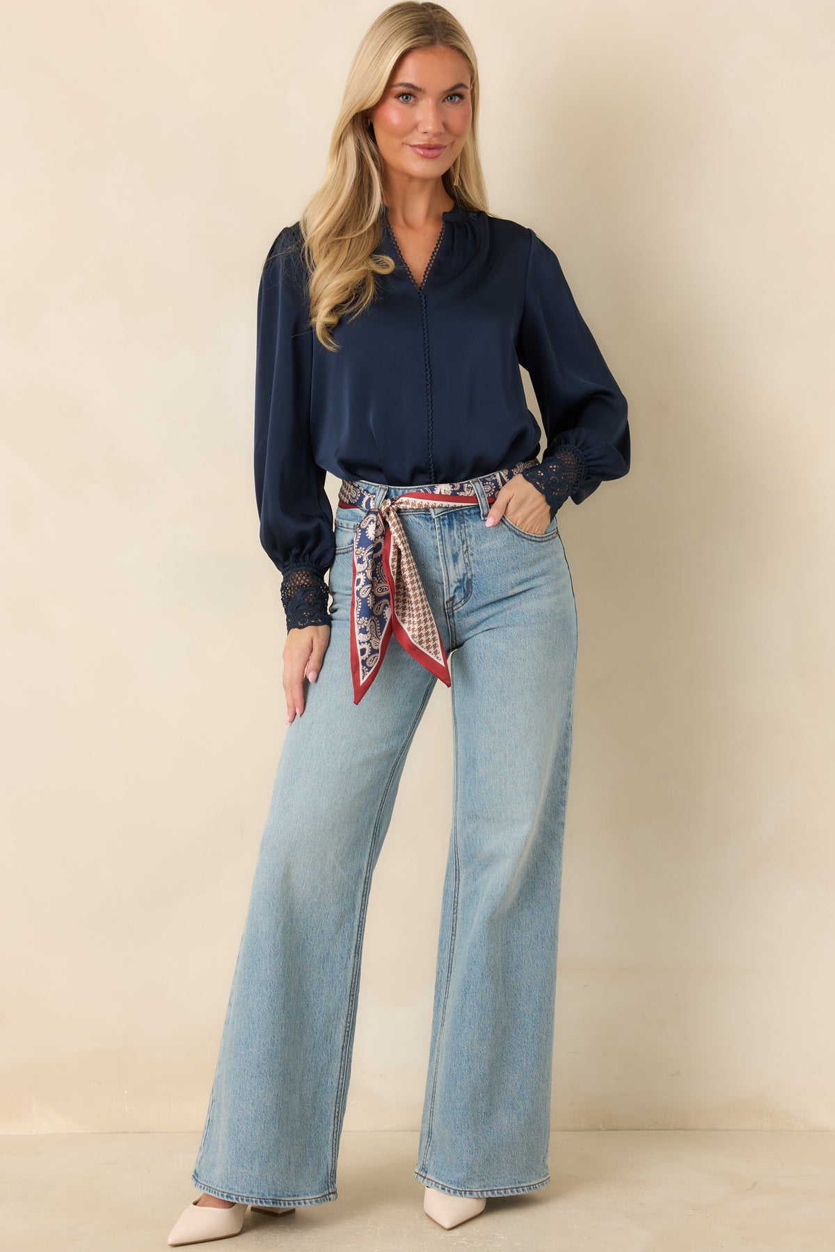 Model wearing Z Supply The Stunner light wash mid-rise jeans with wide legs and a faded finish.
