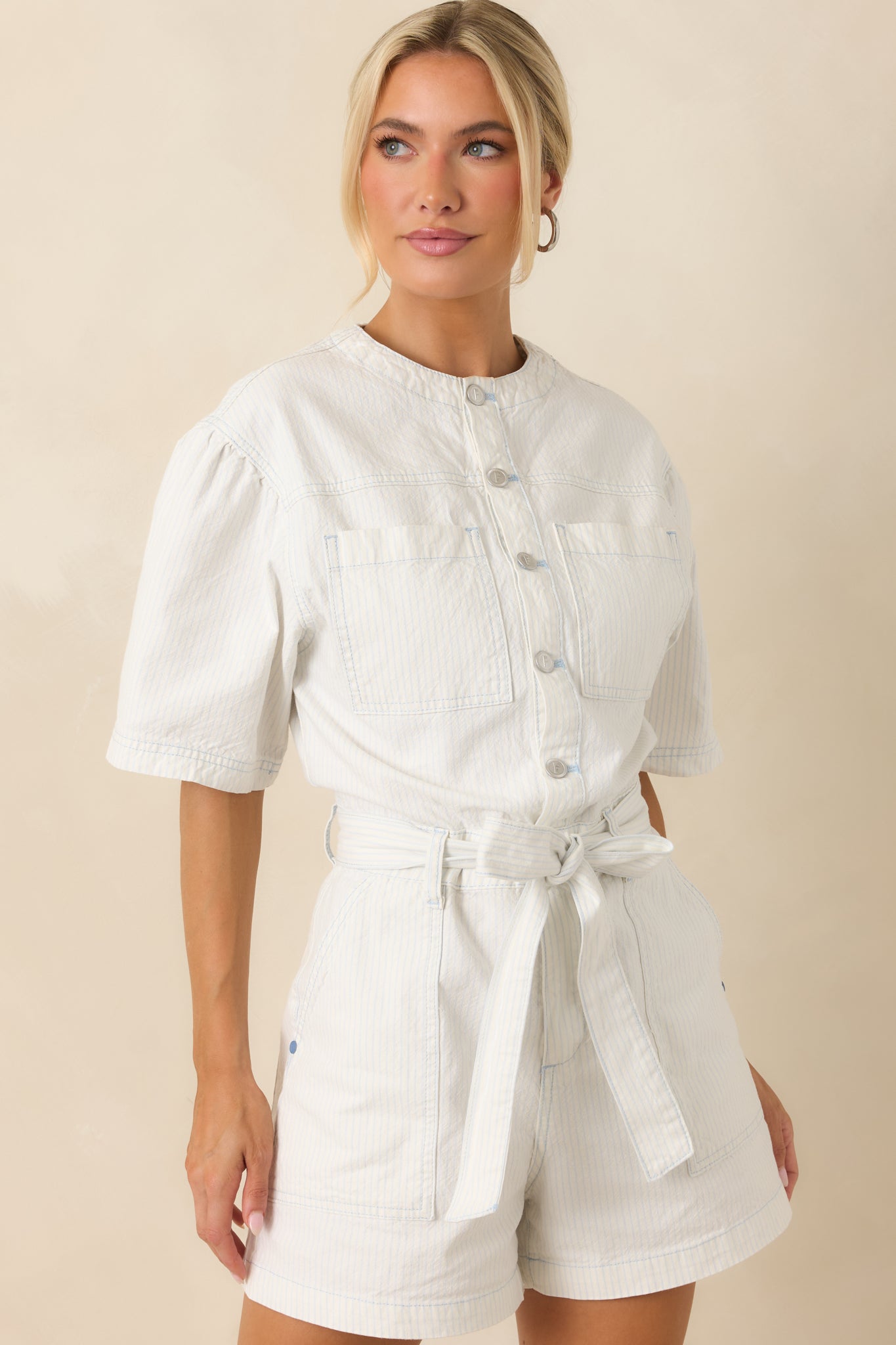 Close-up of removable self-tie waist belt accentuating the striped playsuit silhouette.