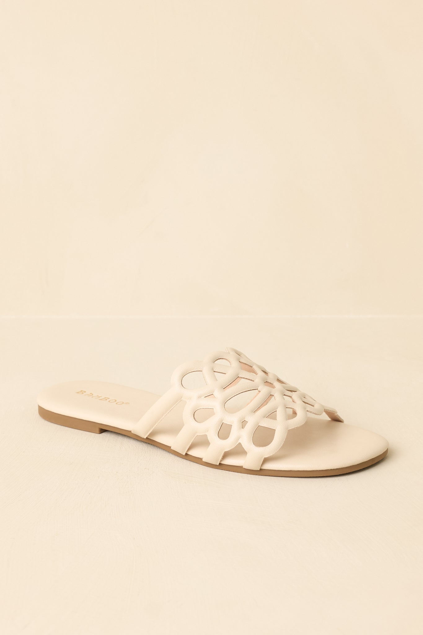 Three-quarter angle showcasing cutout strap details and clean shape.