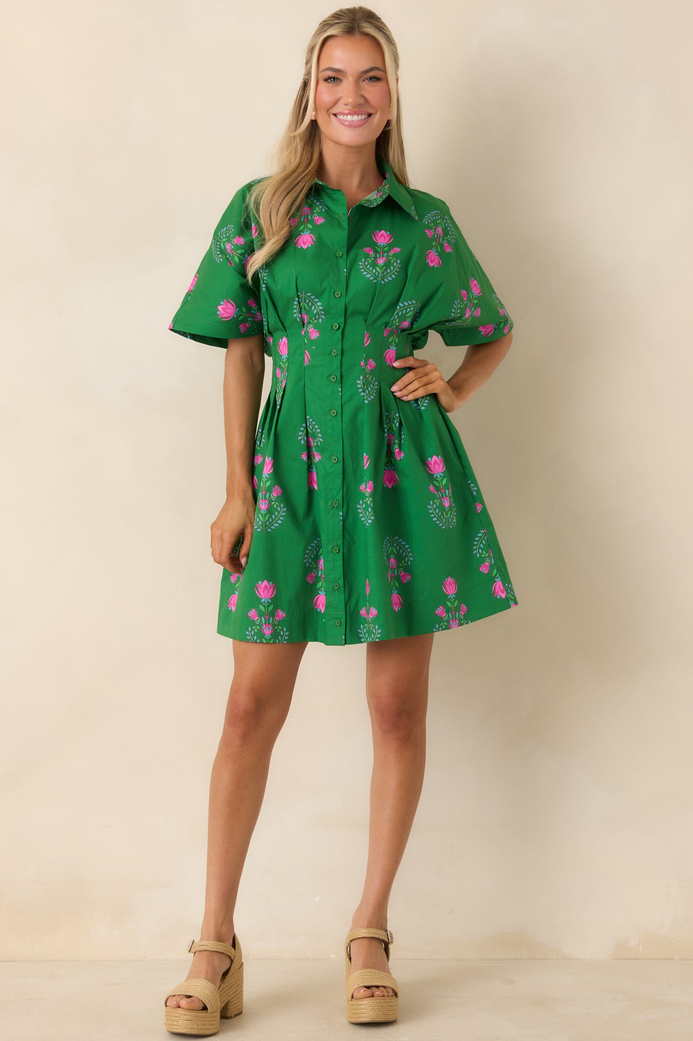 Short sleeve mini dress featuring a softly structured silhouette and hidden side pockets.