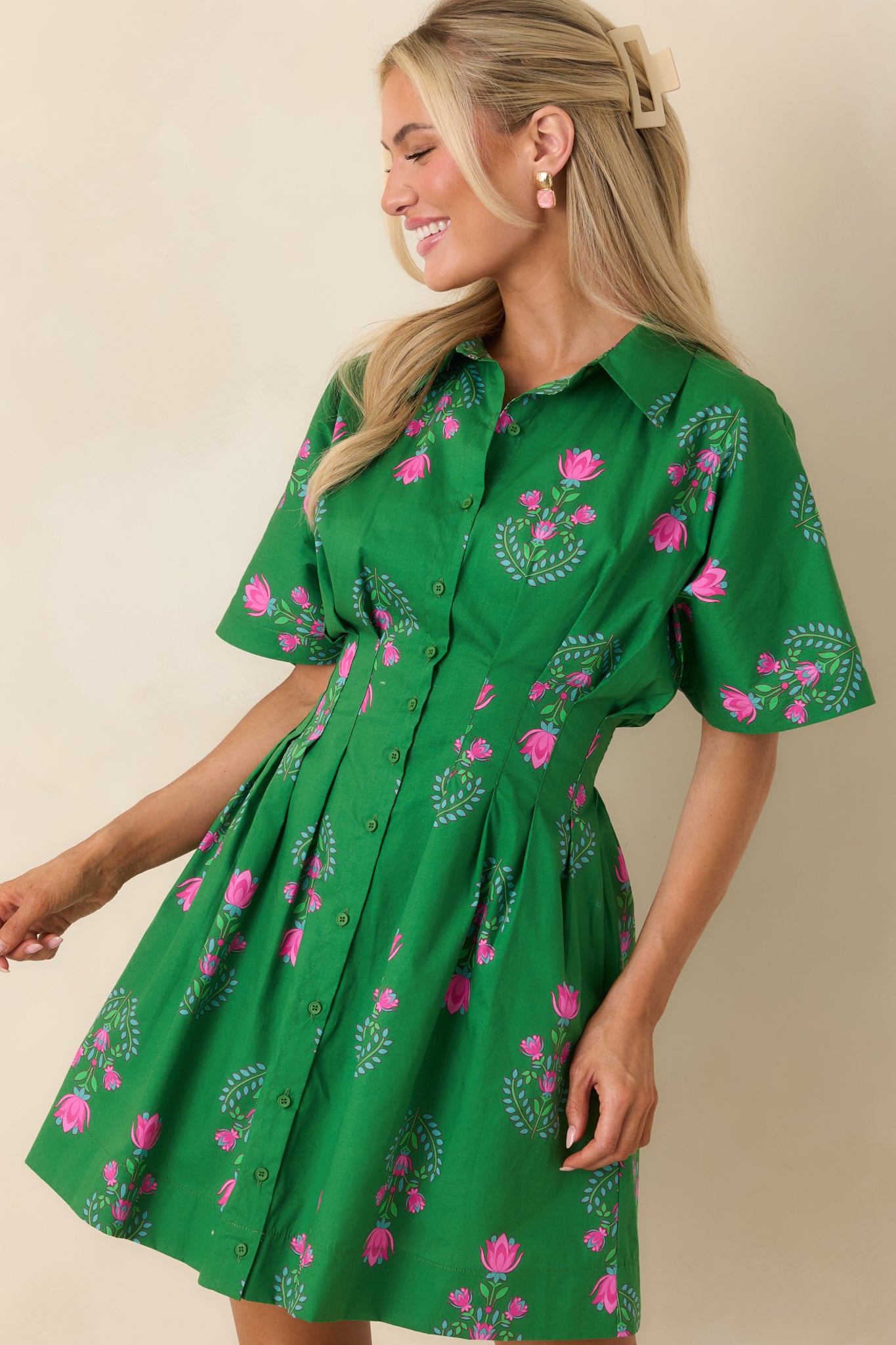 Short sleeve mini dress highlighting the gently tailored bodice and waist shaping.