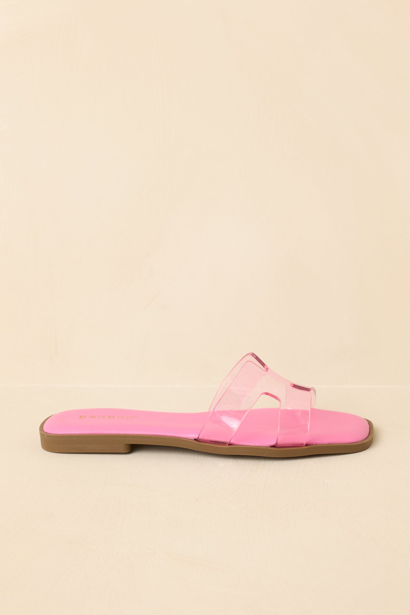 Side profile highlighting flat sole and streamlined slip-on silhouette.