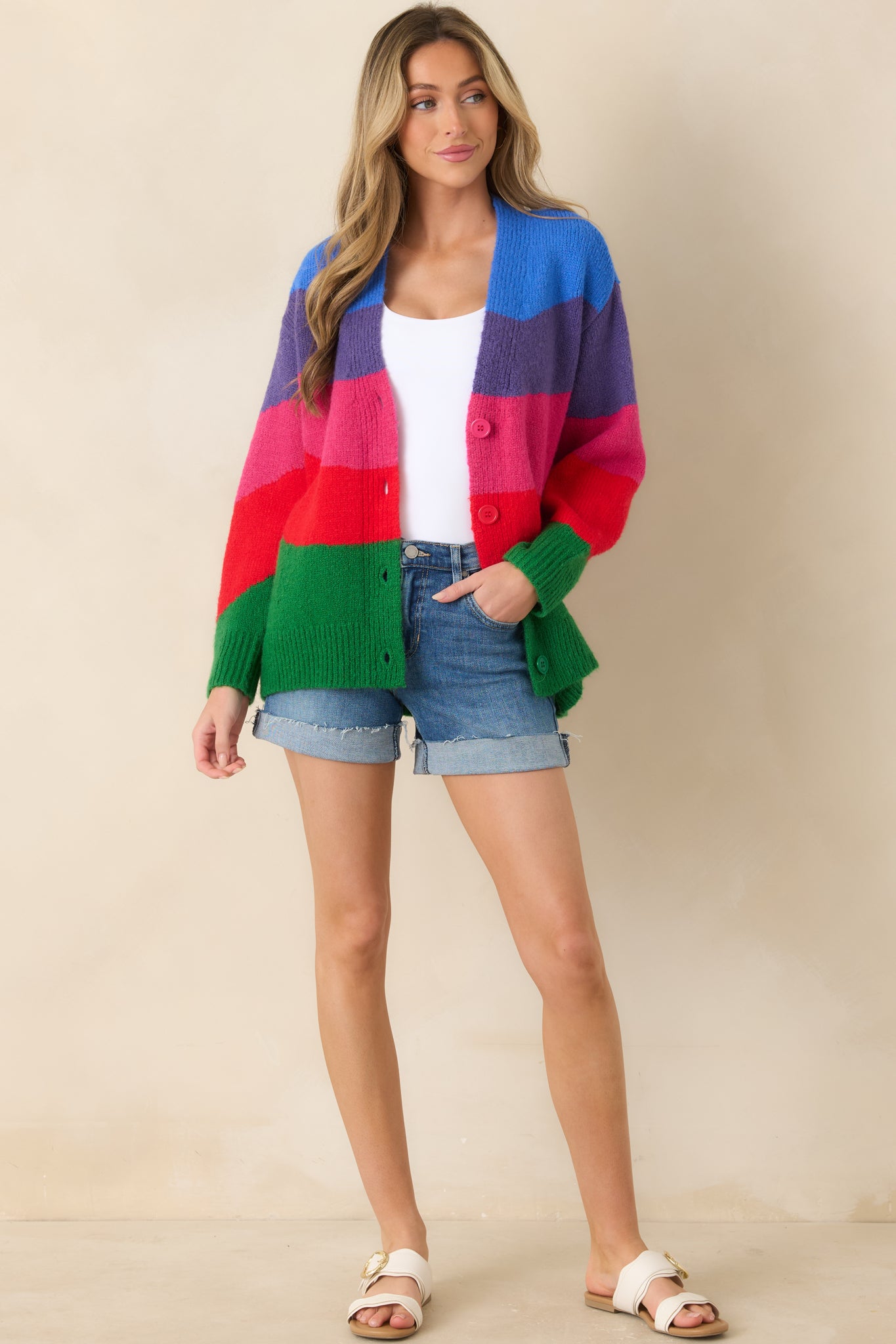 Multi colorblock knit cardigan with a relaxed silhouette, V-neckline, and button-front closure designed for effortless layering and everyday wear.