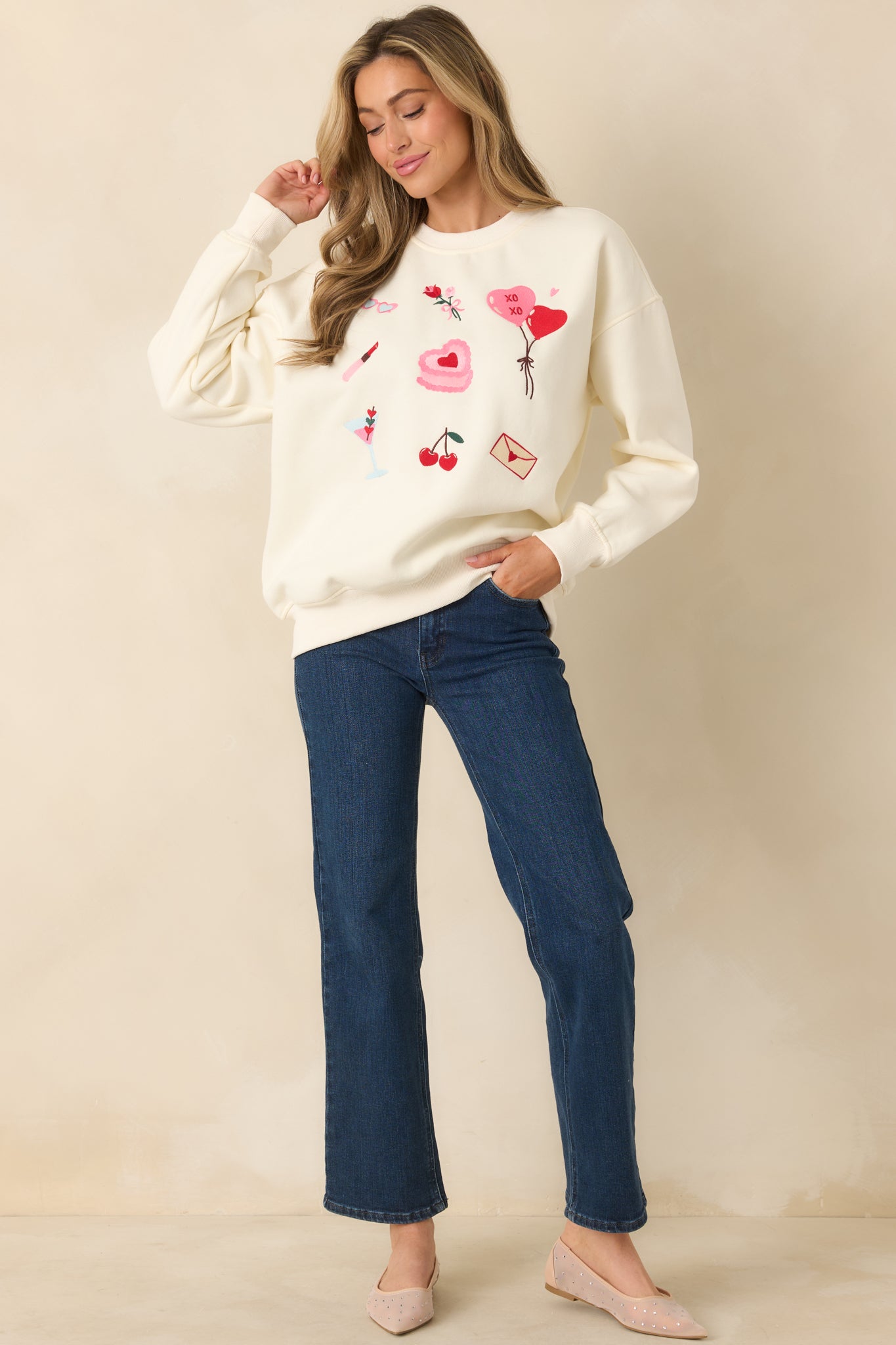 Front-facing view highlighting the long sleeves and ribbed trim at the neckline, cuffs, and hem of the sweatshirt.