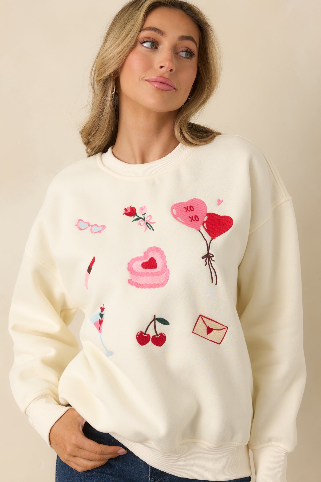 Cropped view showcasing the graphics across the front of the relaxed-fit Valentine-themed crewneck.