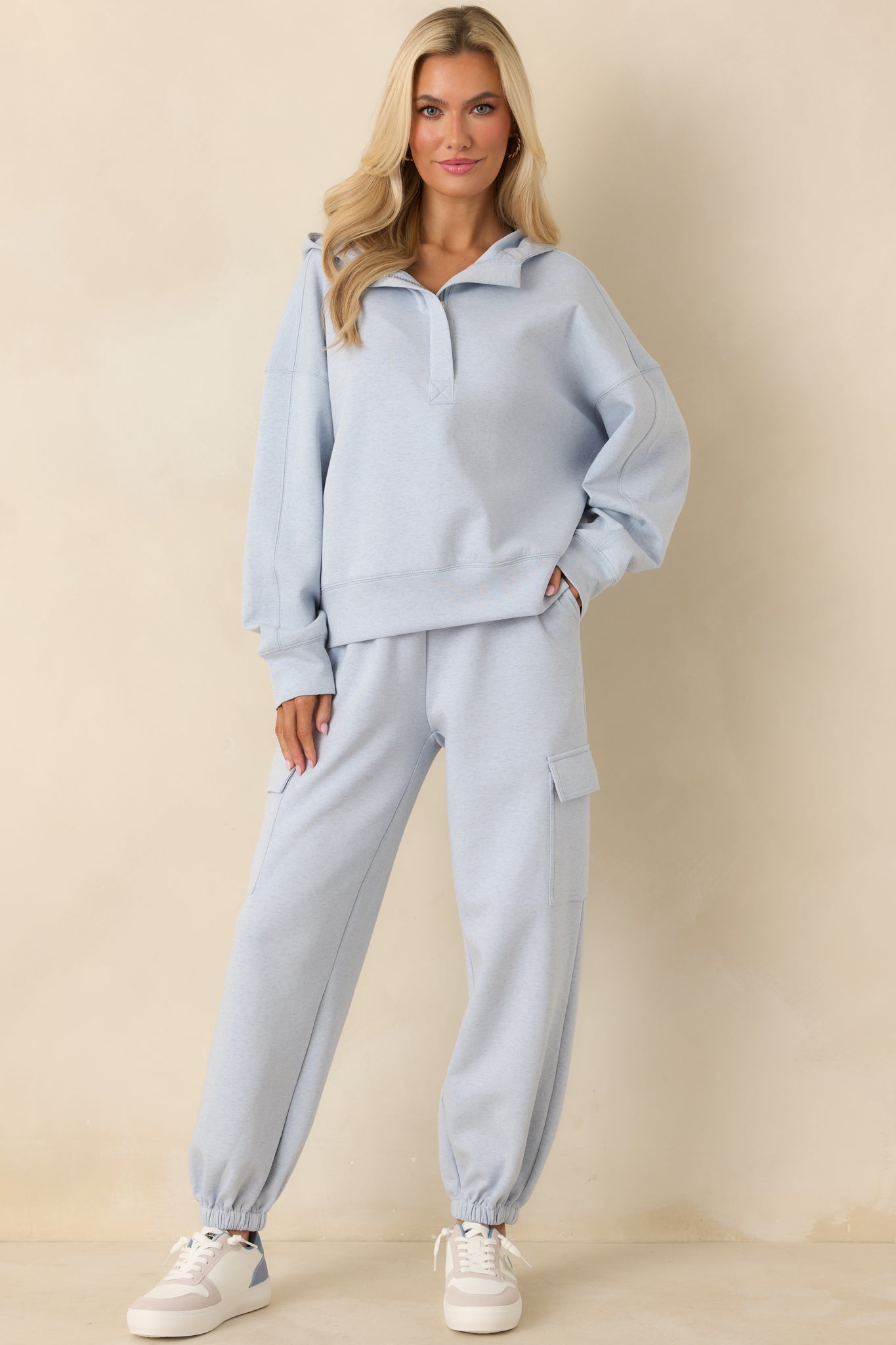 Relaxed-fit heather blue hoodie with ribbed cuffs and ribbed hem finish.