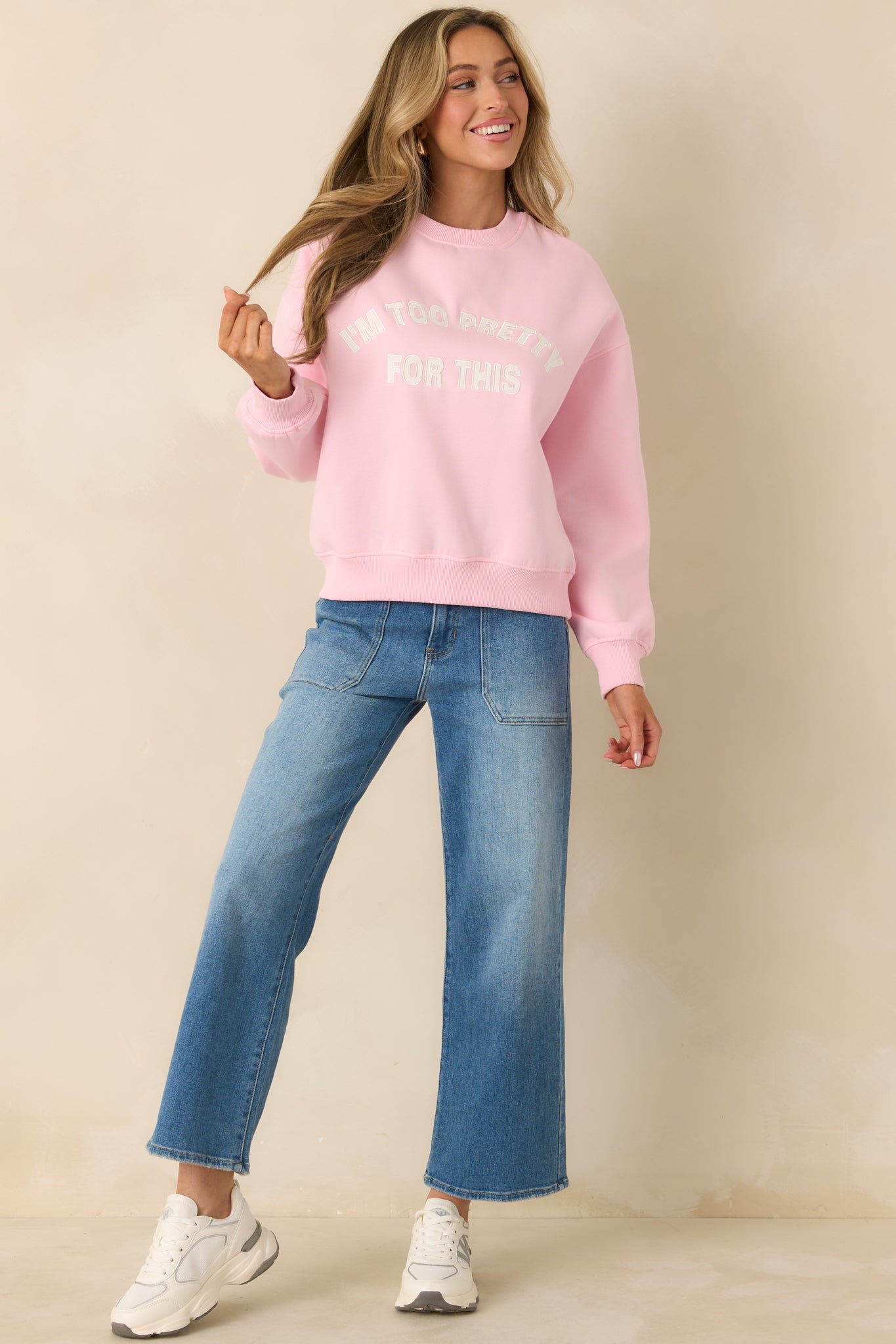 Pink crewneck sweatshirt with relaxed fit and embroidered “I'm Too Pretty For This” front text.