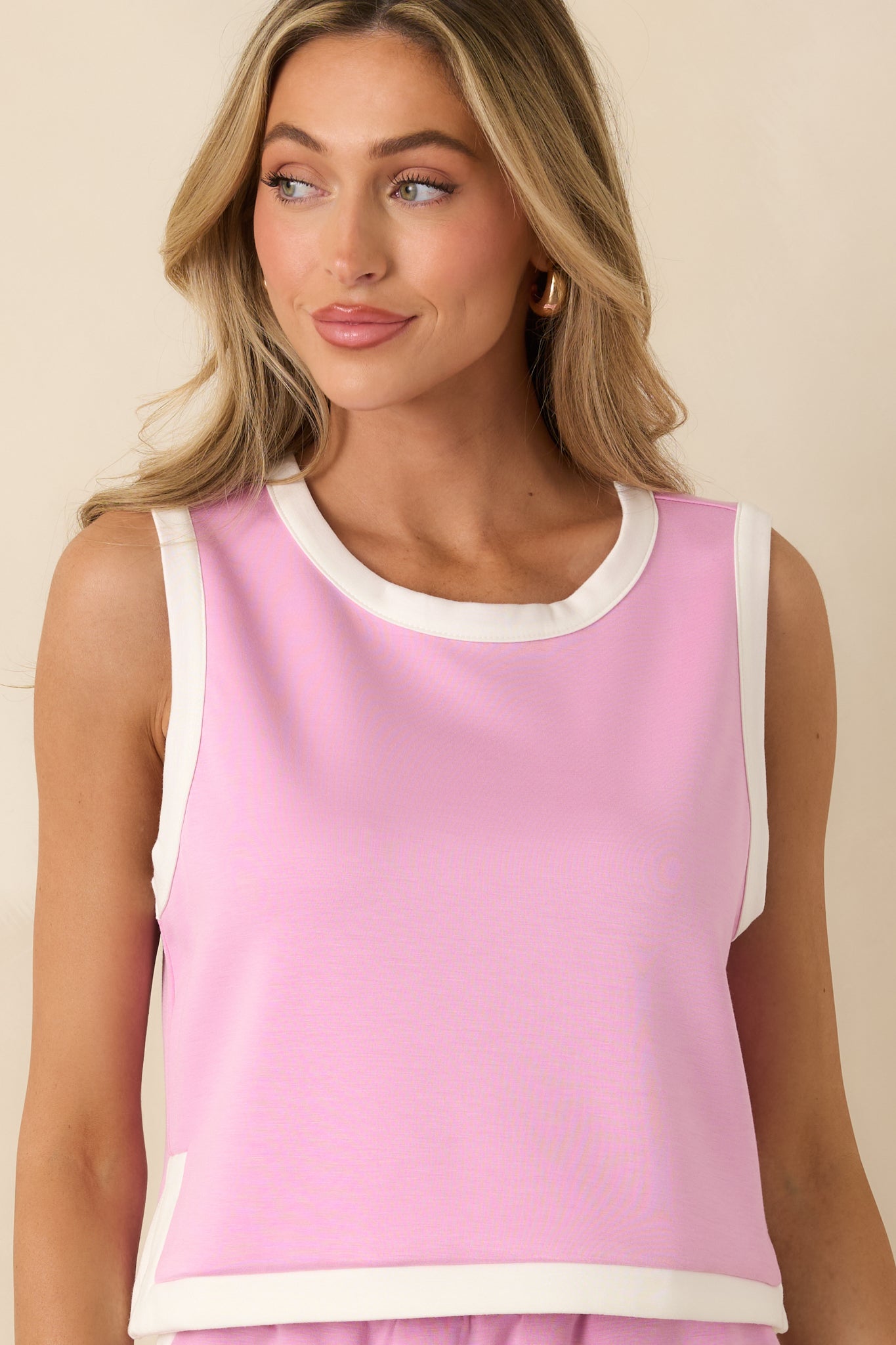 Soft orchid stretch knit highlighting the contrast hem trim and side slit detail.