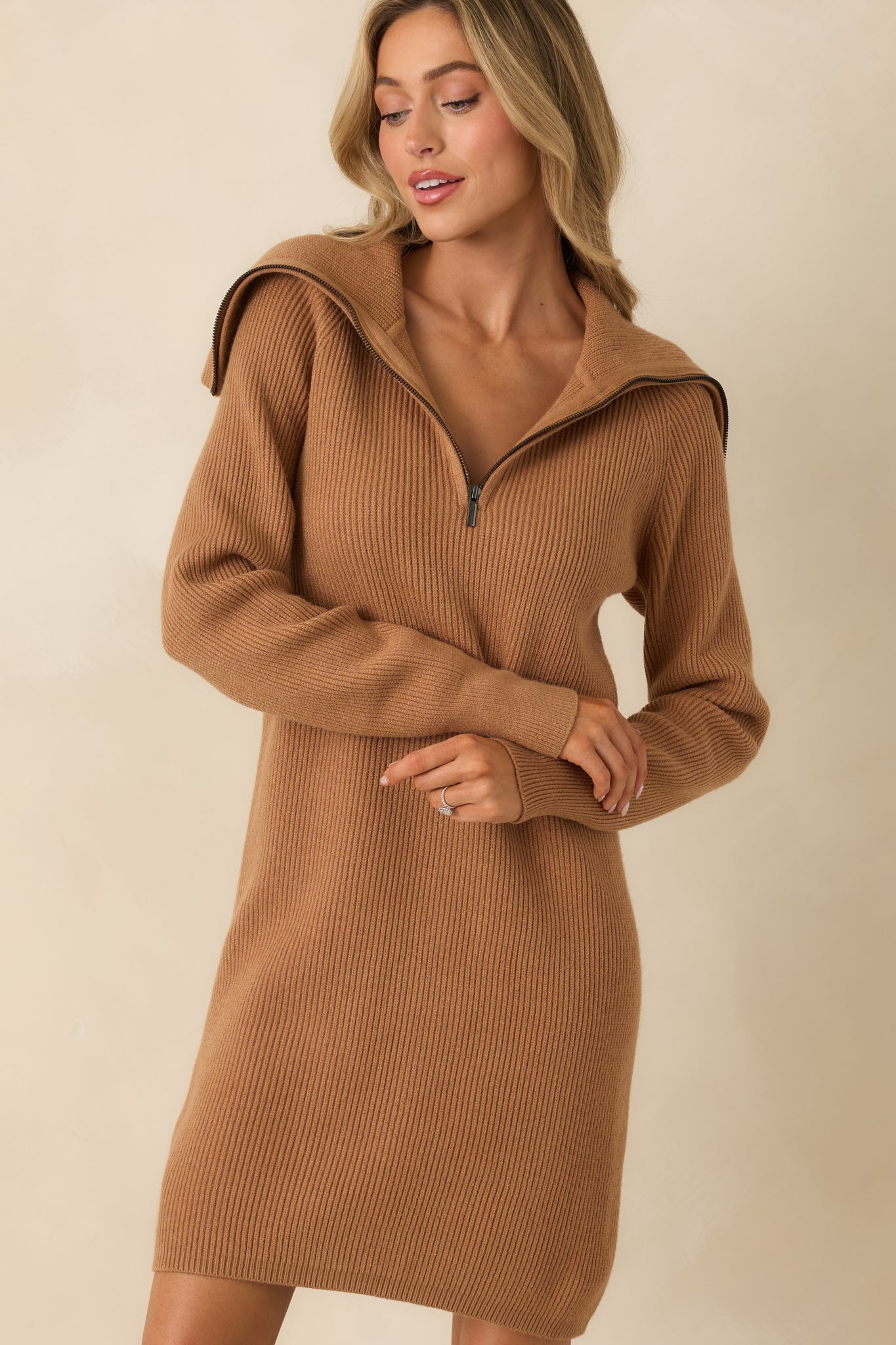 Cropped view highlighting vertical ribbing and soft camel knit.