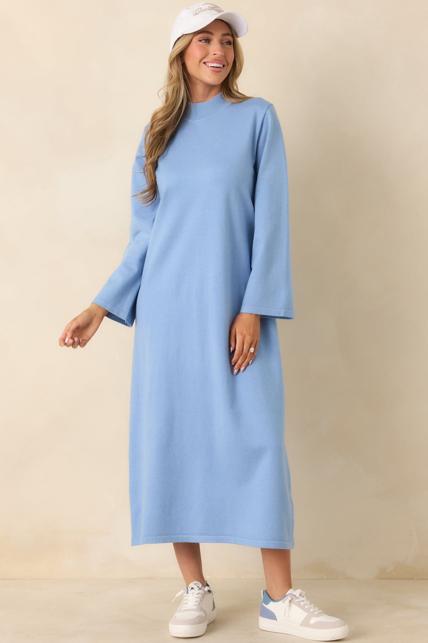 Light blue knit midi dress with a straight shift silhouette and smooth mock neckline.