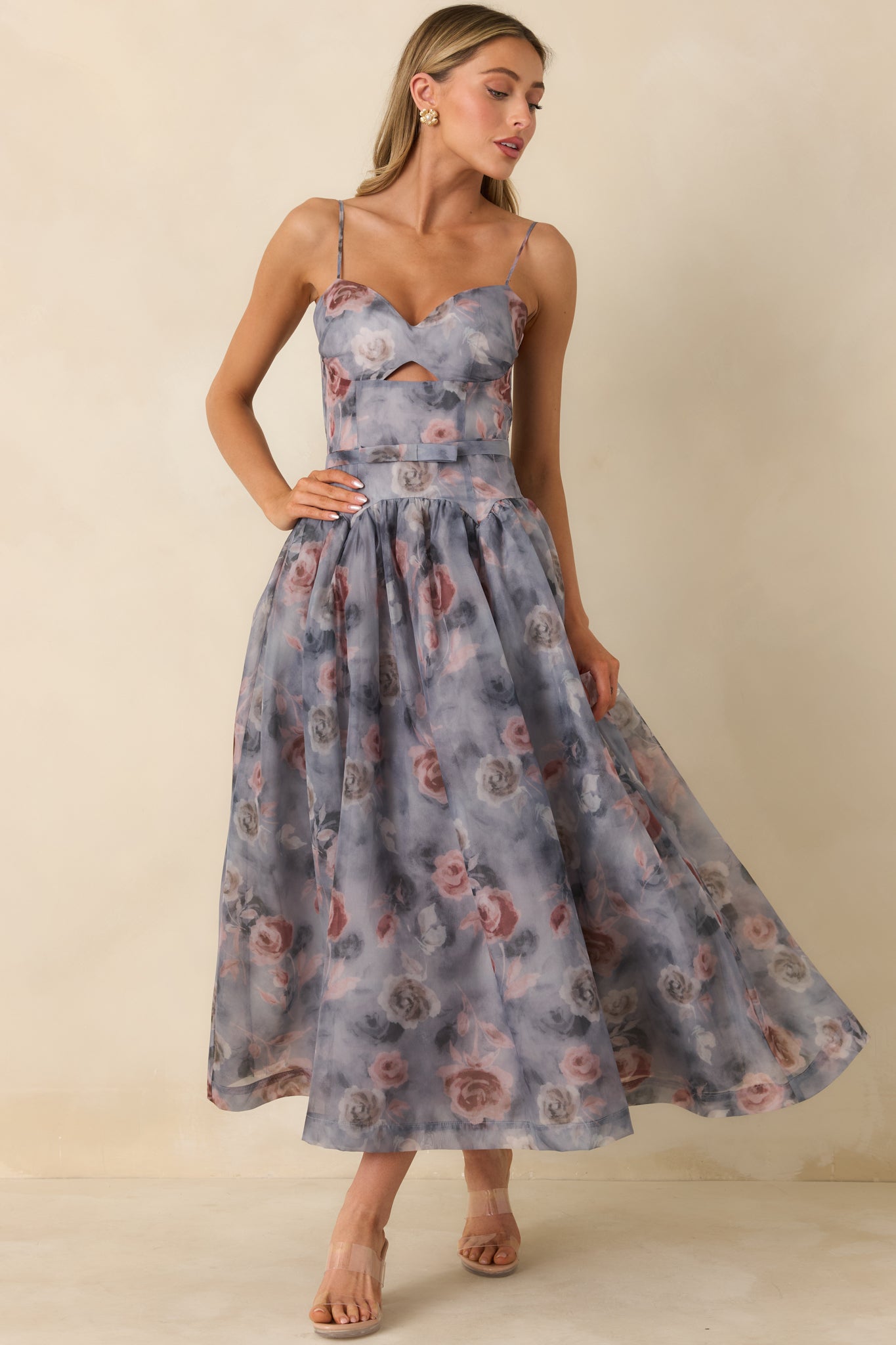 Structured grey midi dress with sweetheart neckline and flared midi-length skirt with floral pattern.