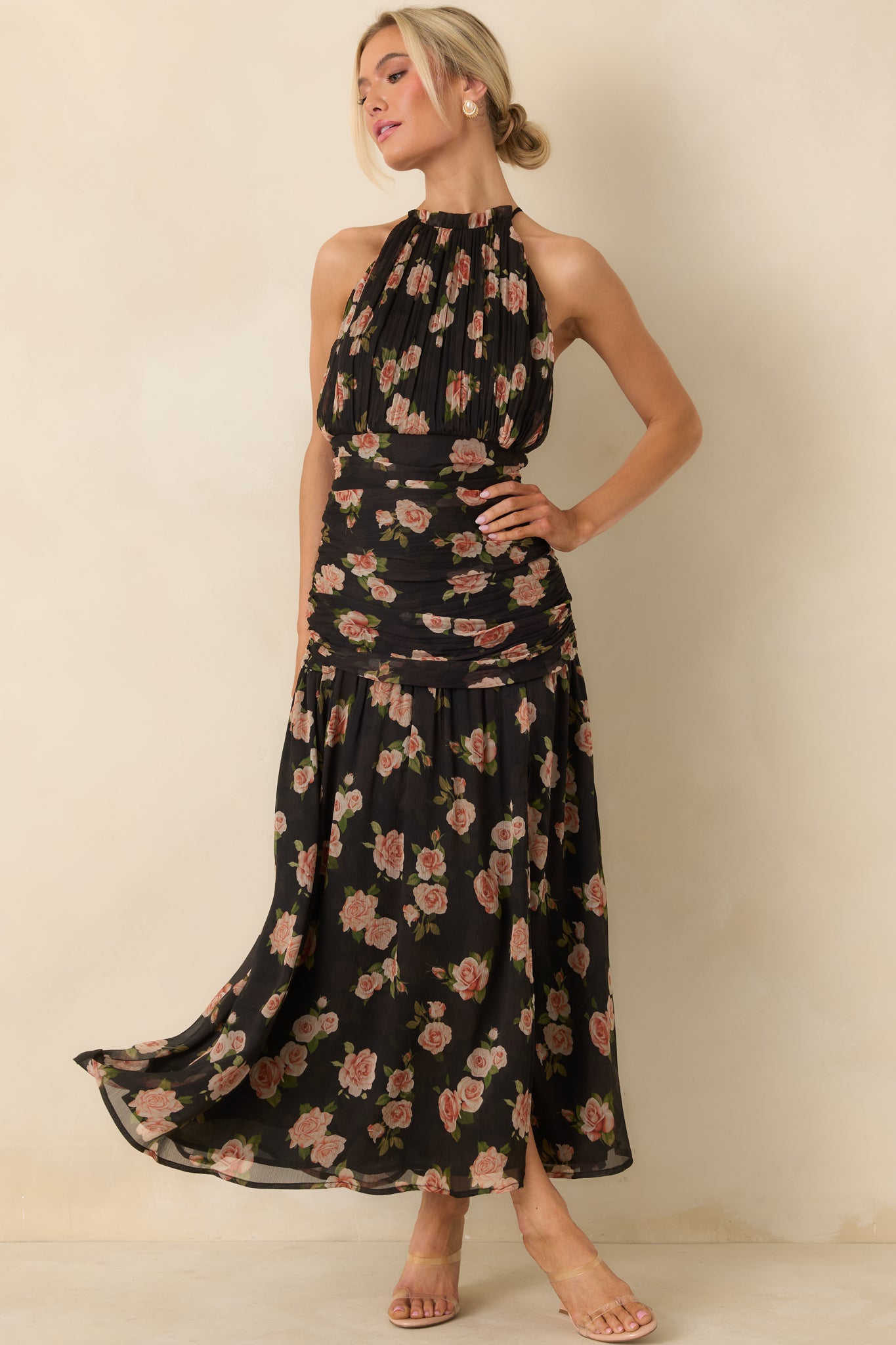 Floral printed black chiffon maxi dress with a softly pleated bodice and lightweight, flowing skirt fabric.