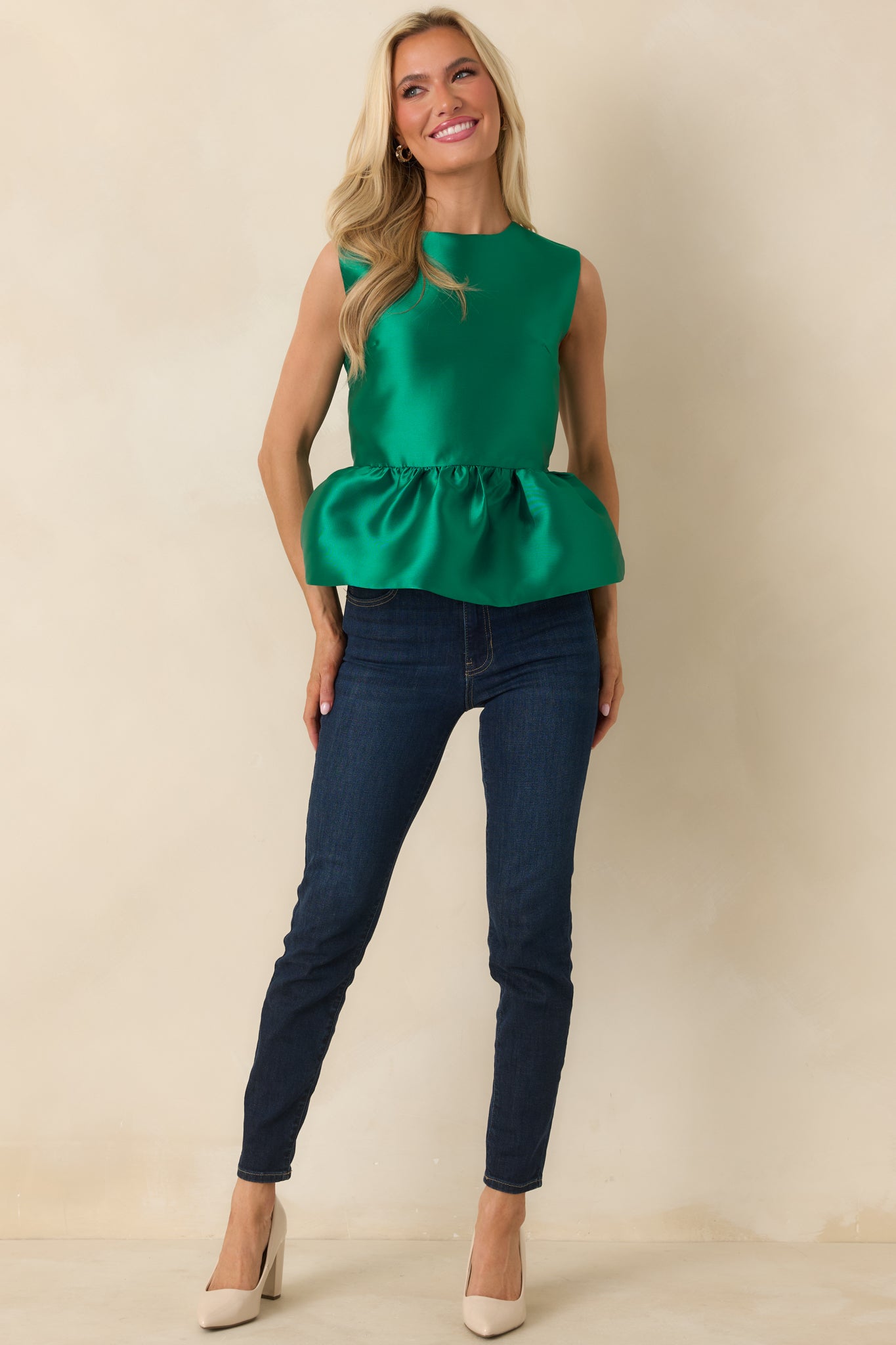 Woven emerald green top with a relaxed sleeveless shape and a smooth, softly flaring hemline.