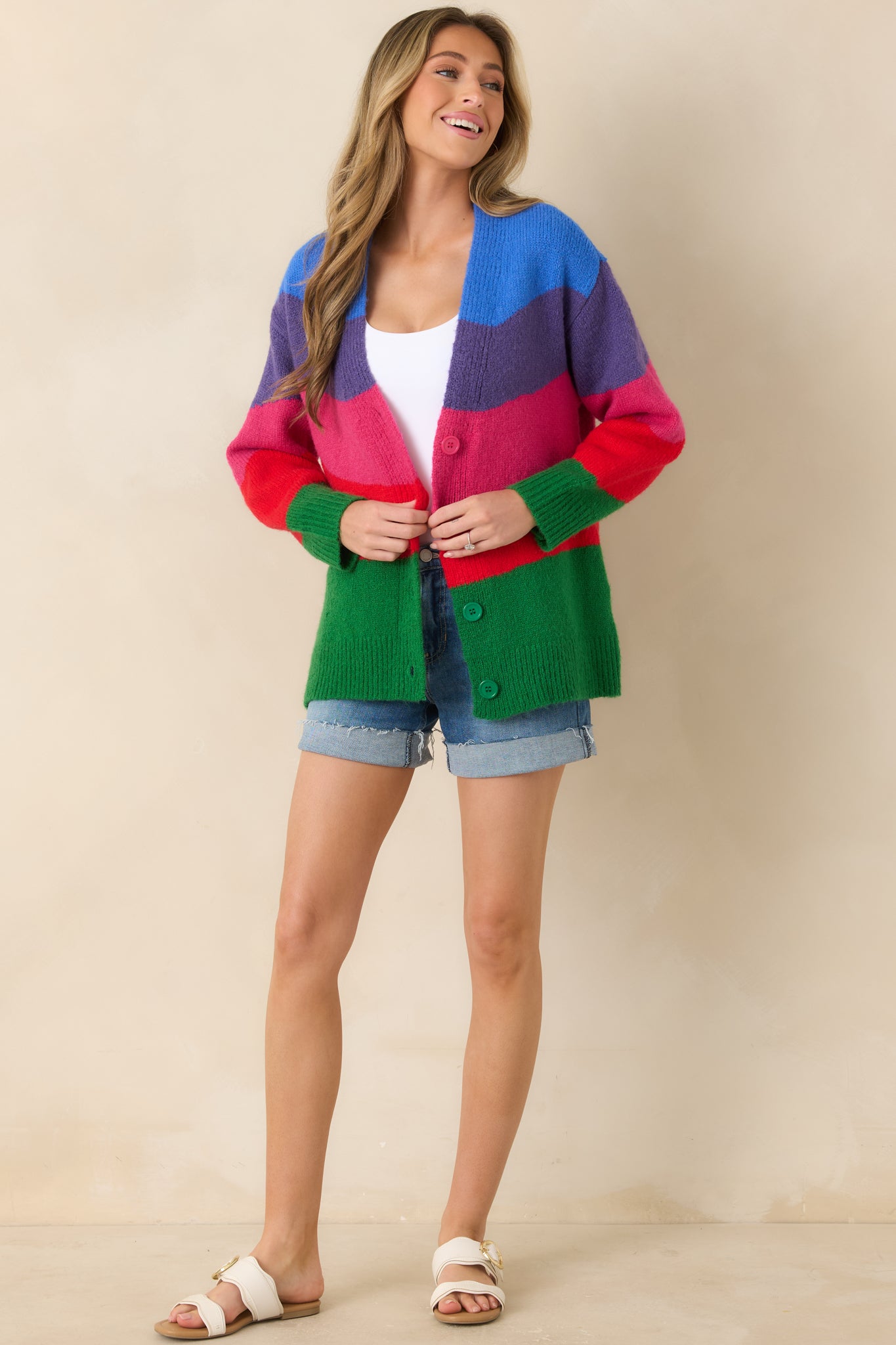 Colorblock cardigan showcasing a relaxed fit with front buttons and a flattering drape through the torso and sleeves.