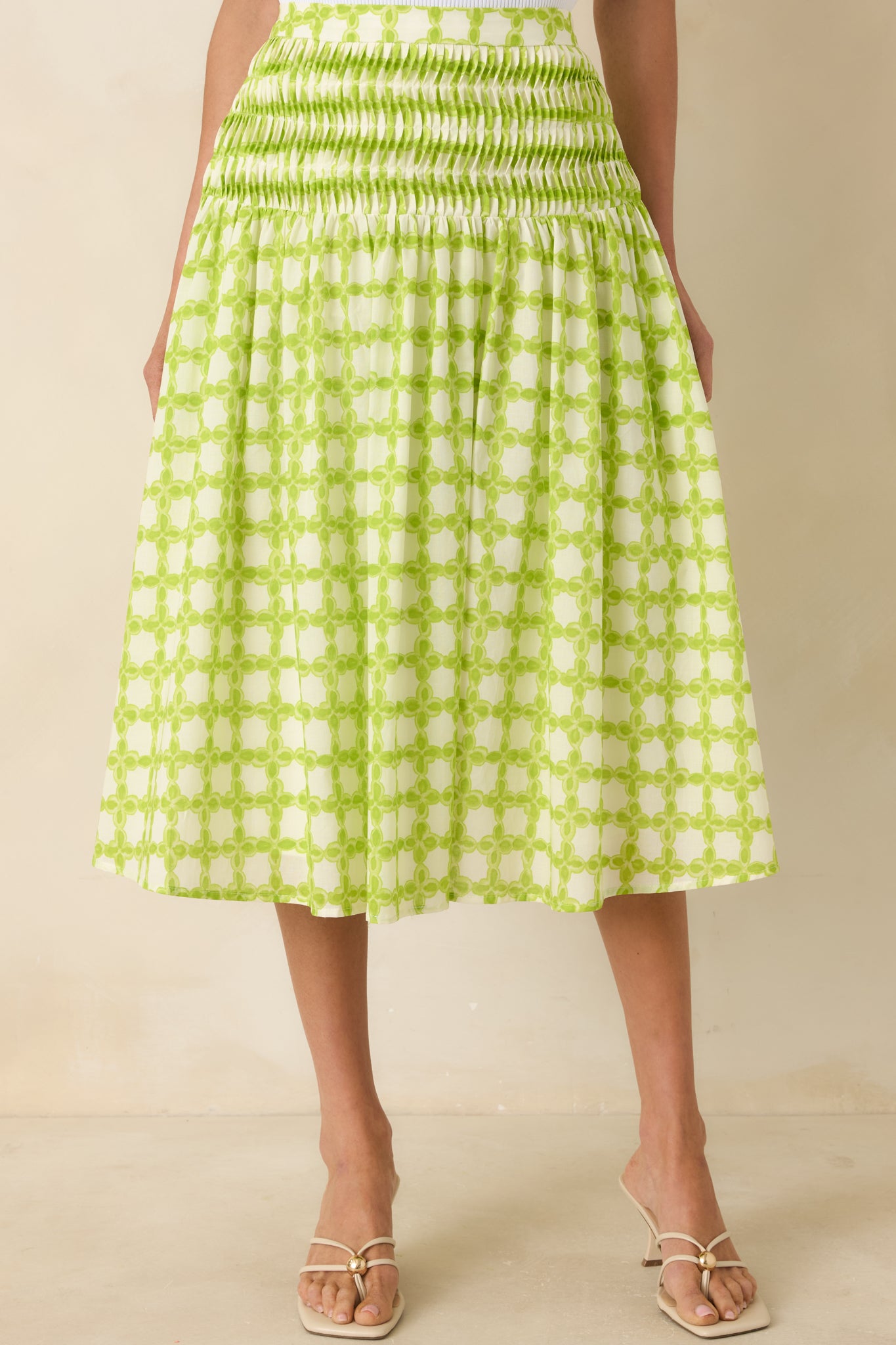 Geometric print detail on lightweight cotton skirt with soft, flowing fabric.