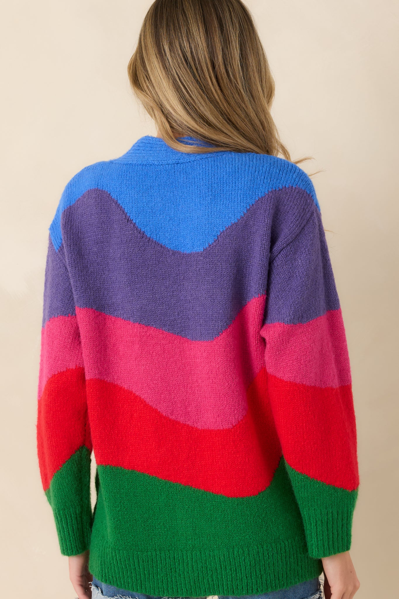 Back view of the colorblock cardigan featuring long sleeves, relaxed silhouette, and ribbed hem for a clean, finished look.