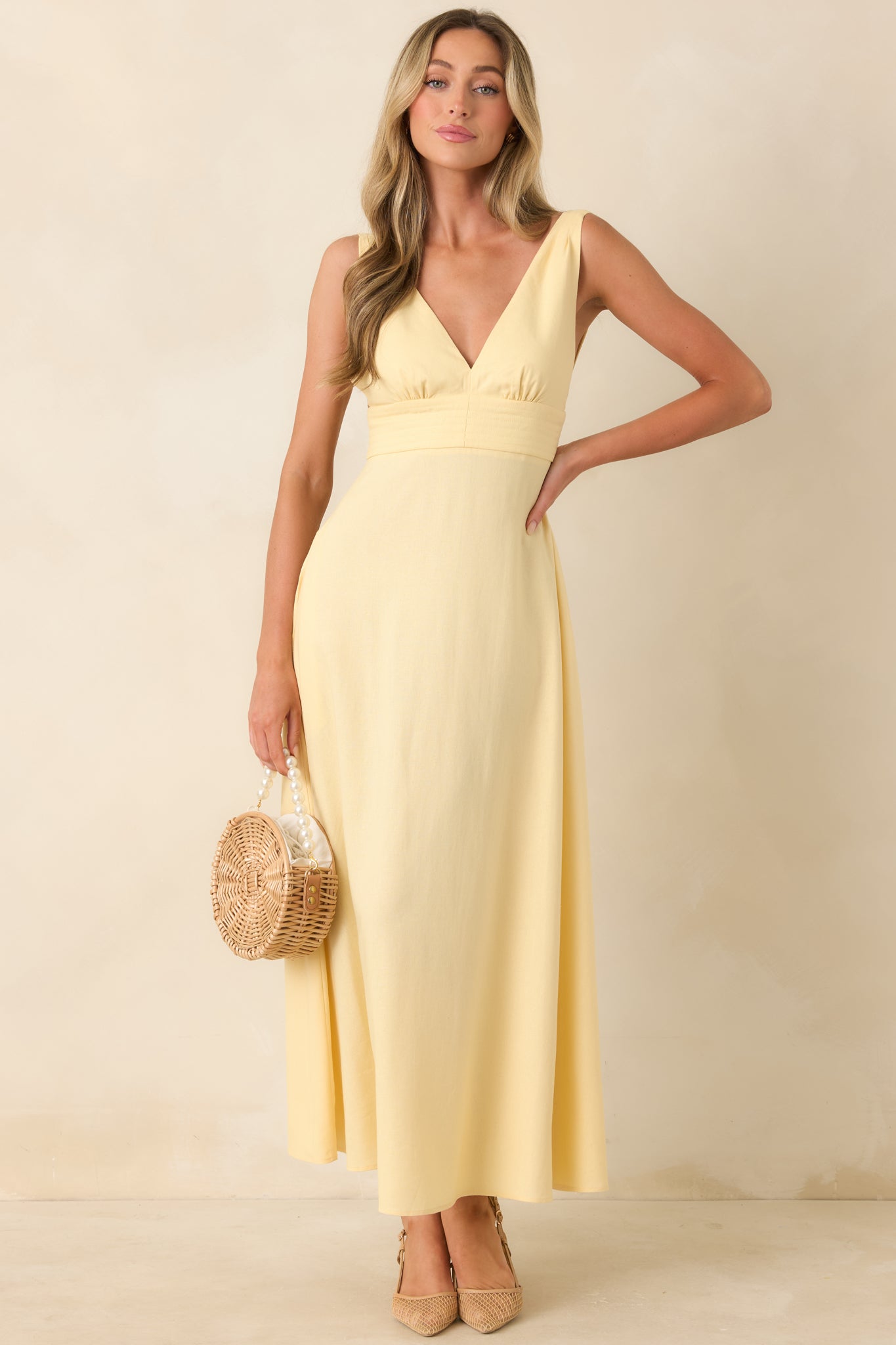 Elegant midi dress with wide straps and a softly tailored bodice.