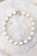 2 The New Classic Gold Pearl Necklace at reddress.com