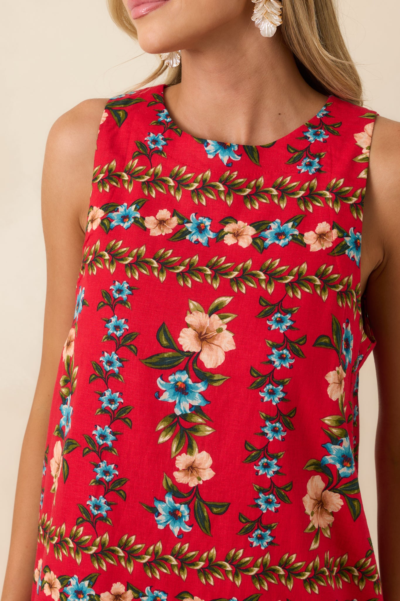 Detailed close-up of the red multi floral print and linen blend fabric texture.