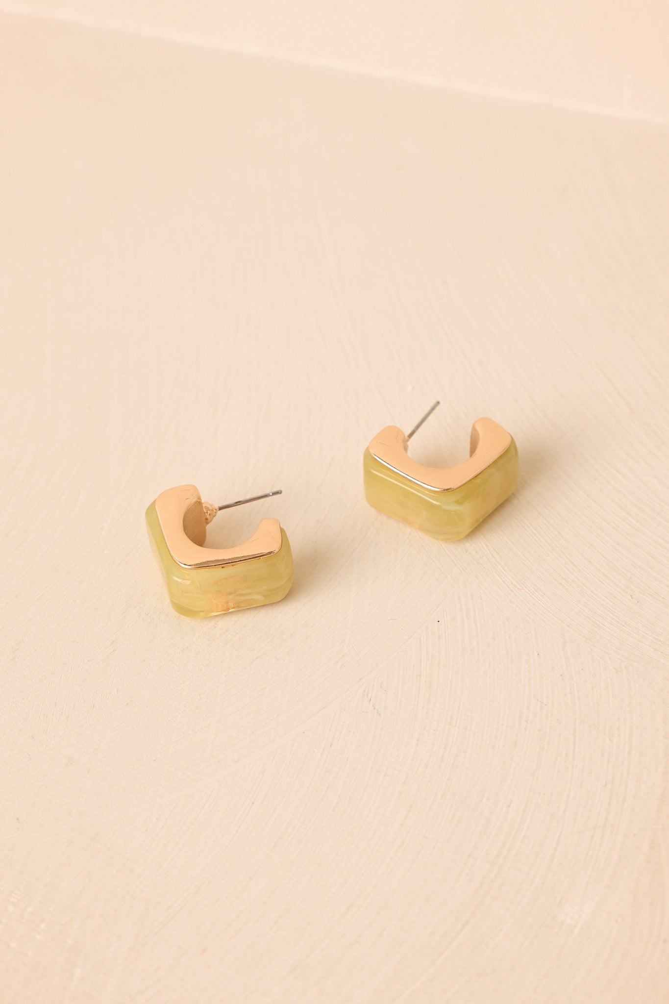 Statement square hoop earrings showcasing a bold chartreuse resin frame paired with sleek gold-tone hardware.