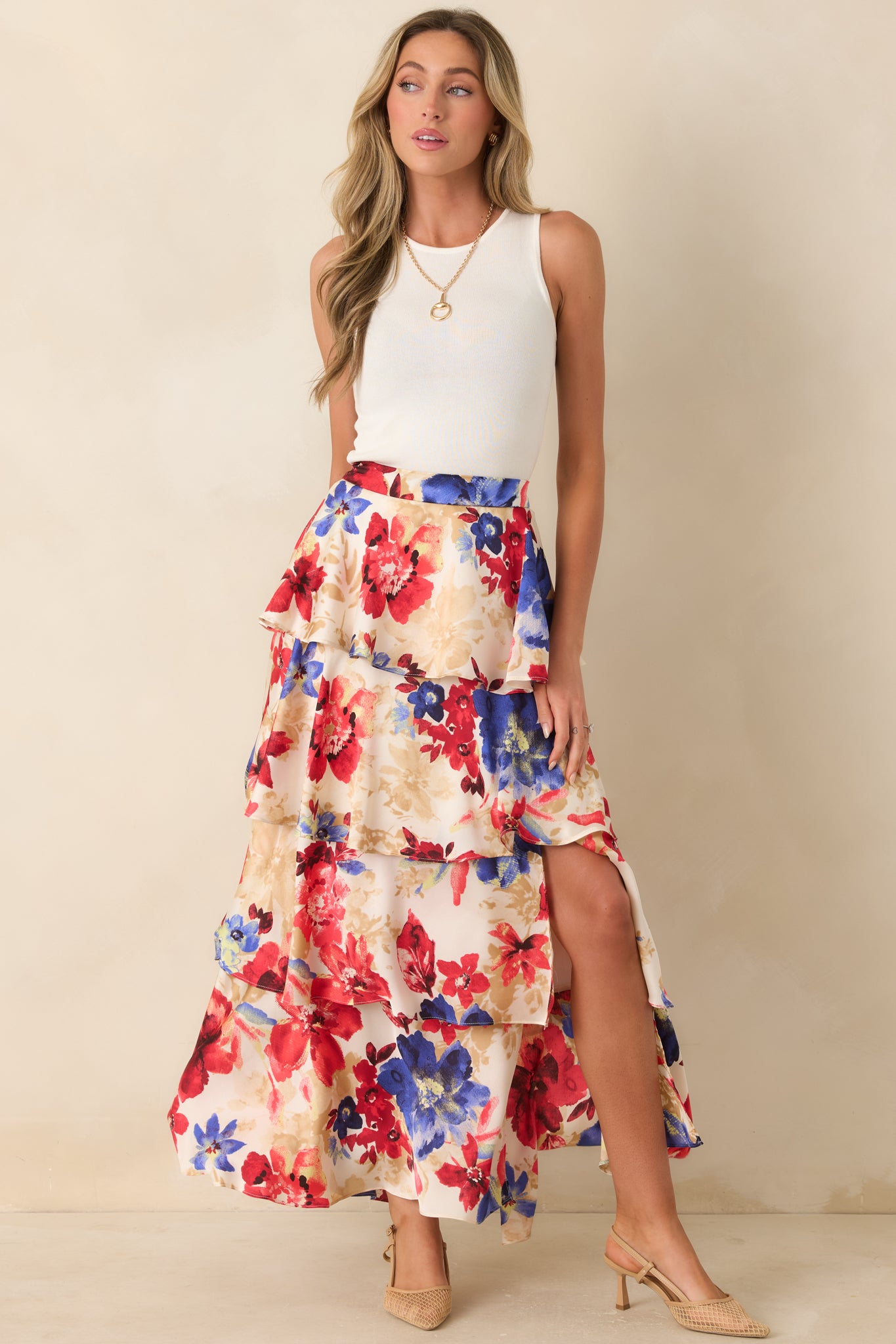 Ivory and red multi floral maxi skirt with cascading tiers and a softly structured flow.