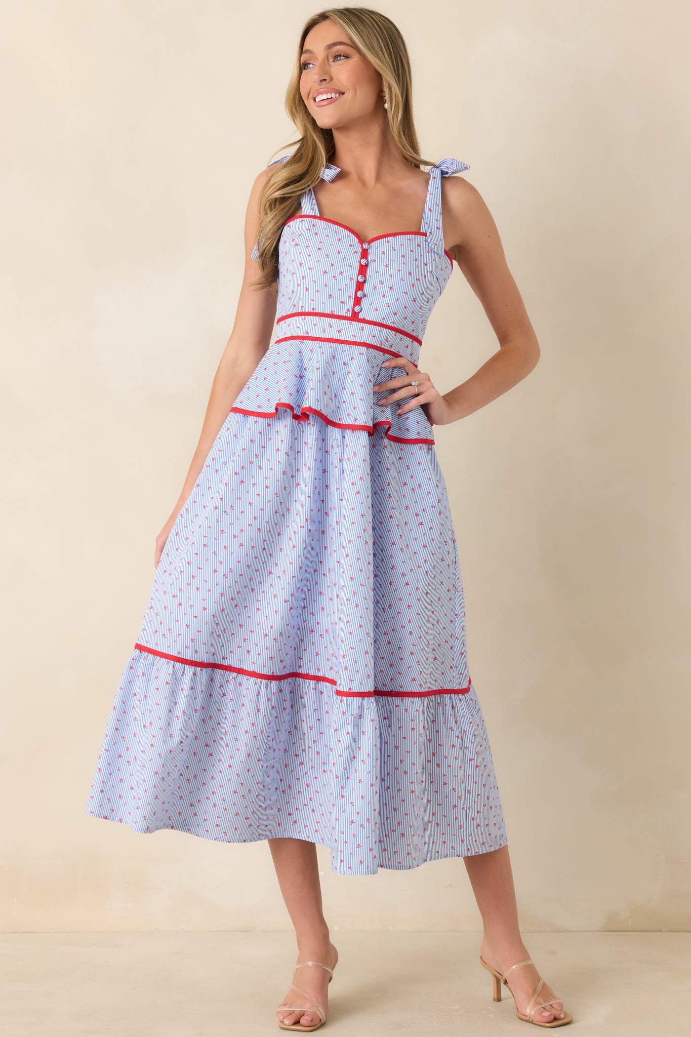 Sweetheart neckline midi dress with front button detailing and comfortable smocked back shaping.