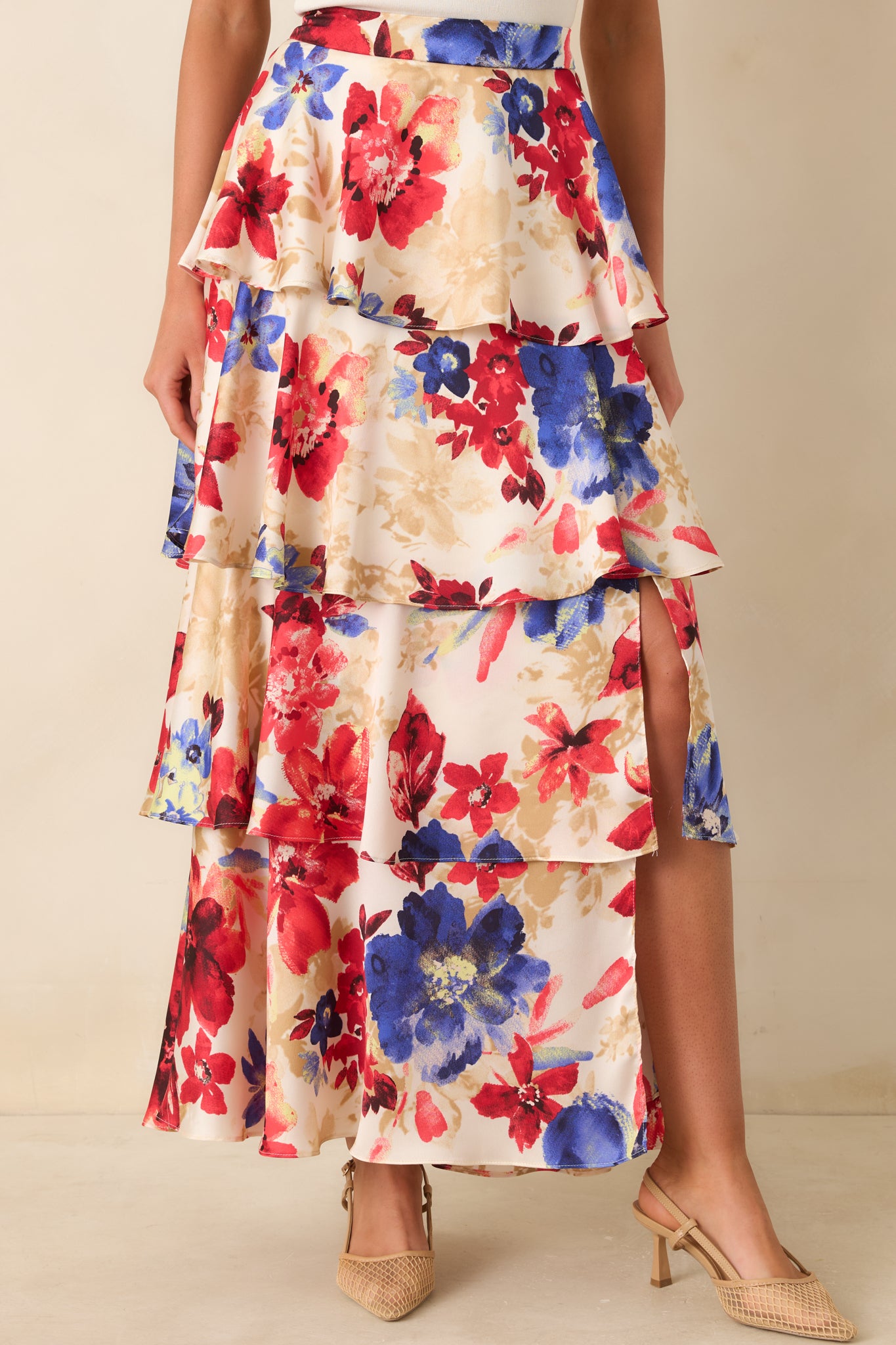Close view of the red floral print set against an ivory background.