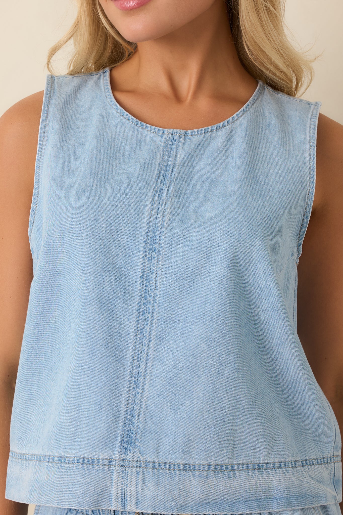 Close-up of cotton denim fabric showing seam construction and smooth texture.