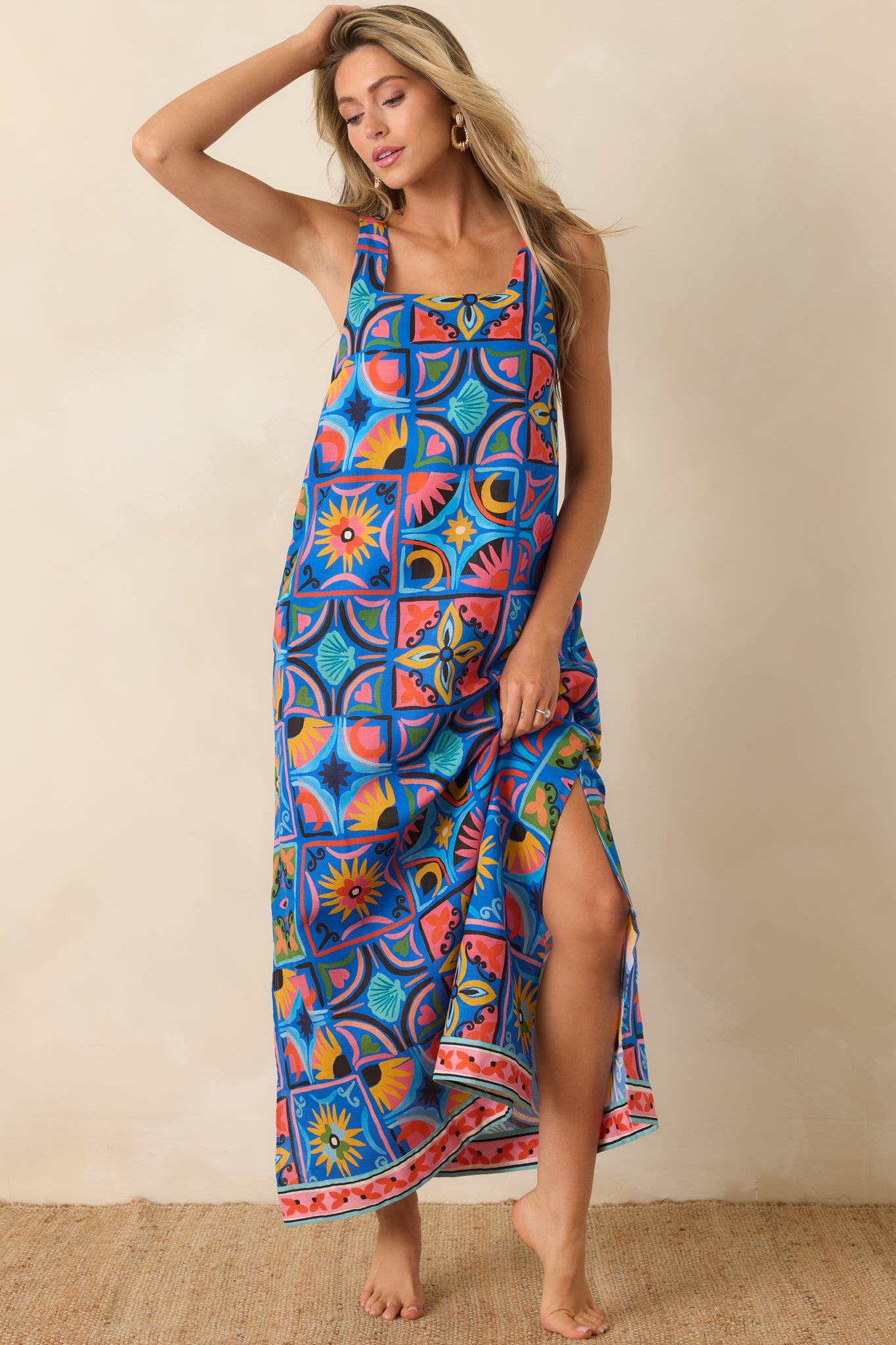 Blue tile print dress with a relaxed maxi silhouette, lightweight linen-blend fabric, and effortless drape from neckline to hem.