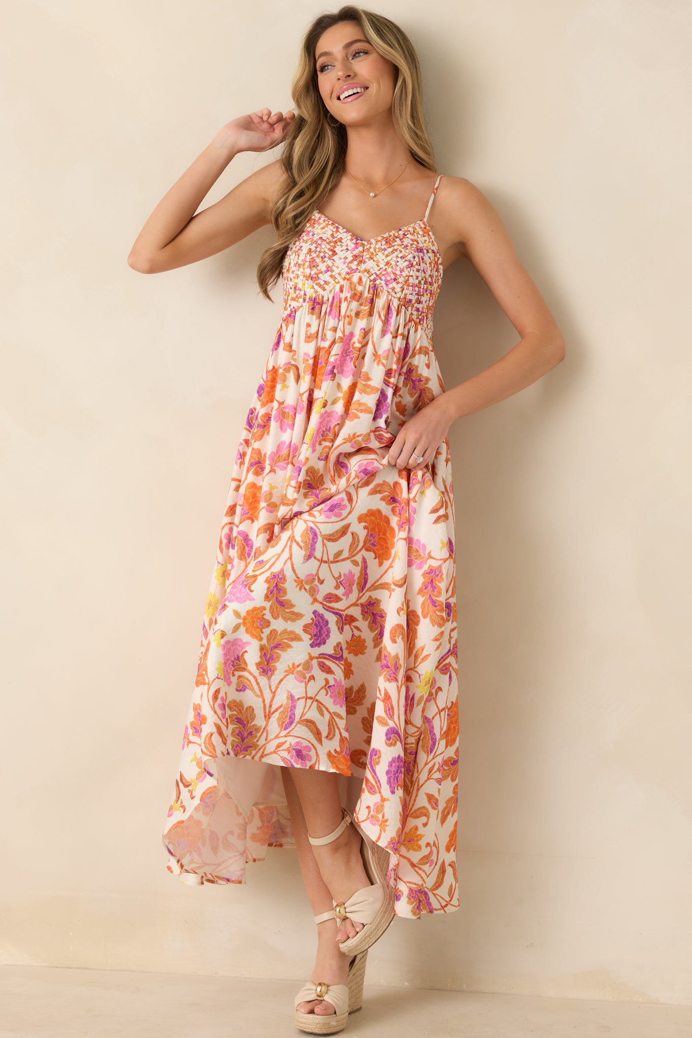 Floral maxi dress with woven bust detailing, adjustable straps, and a softly flowing gathered skirt.

