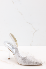 Outer view of these heels that feature a pointed toe, rhinestone embellishments, and a non-adjustable back strap.