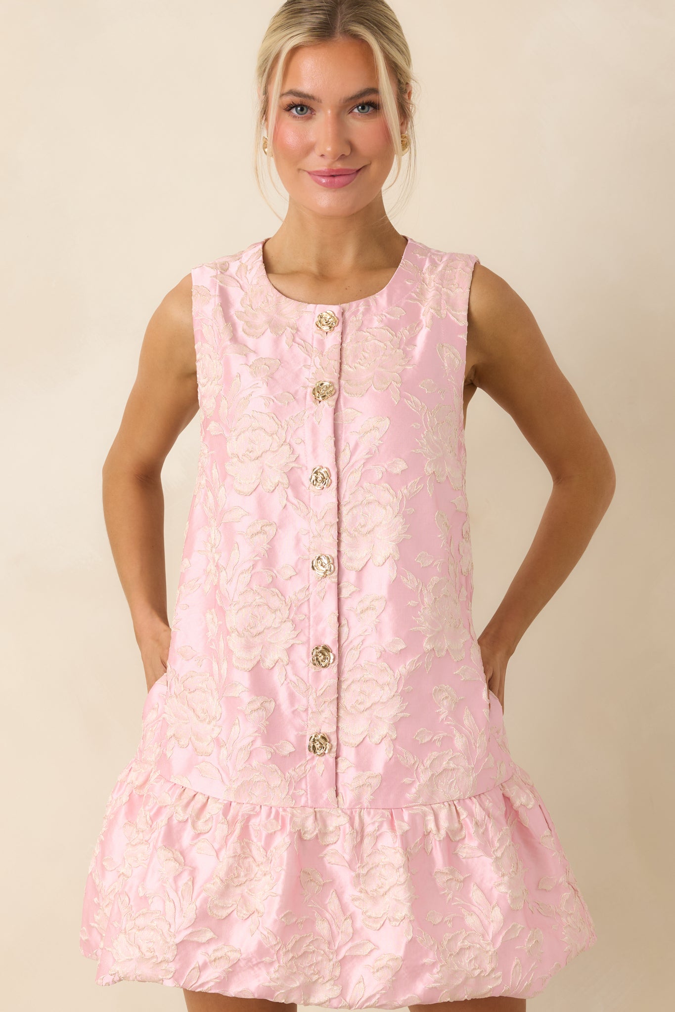 Focused view of structured bodice with intricate floral texture and vintage-inspired buttons.
