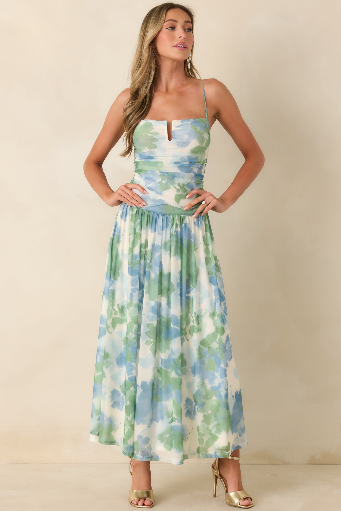 Lightweight mesh maxi dress with blue and green print, subtle notch neckline, and soft movement.