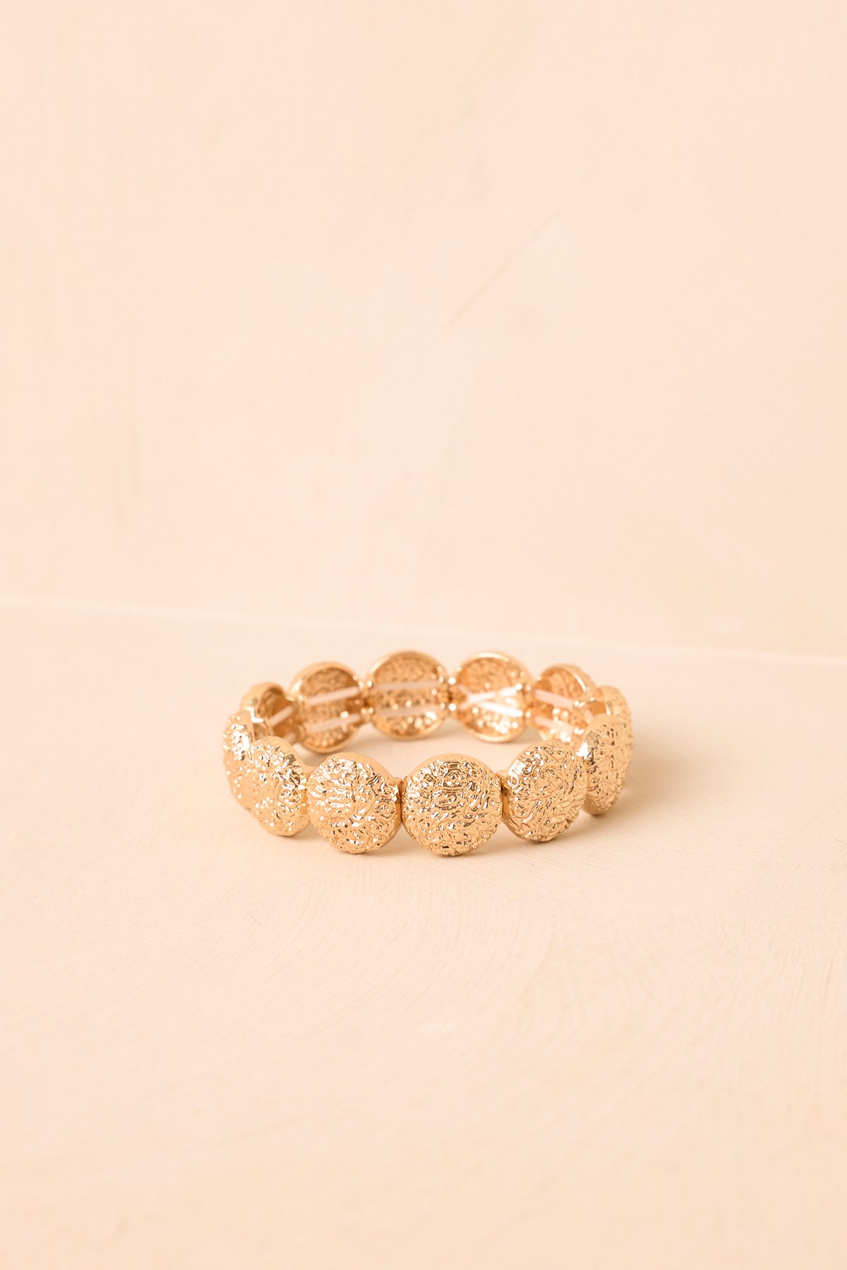 Round of Applause Gold Textured Disc Stretch Bracelet