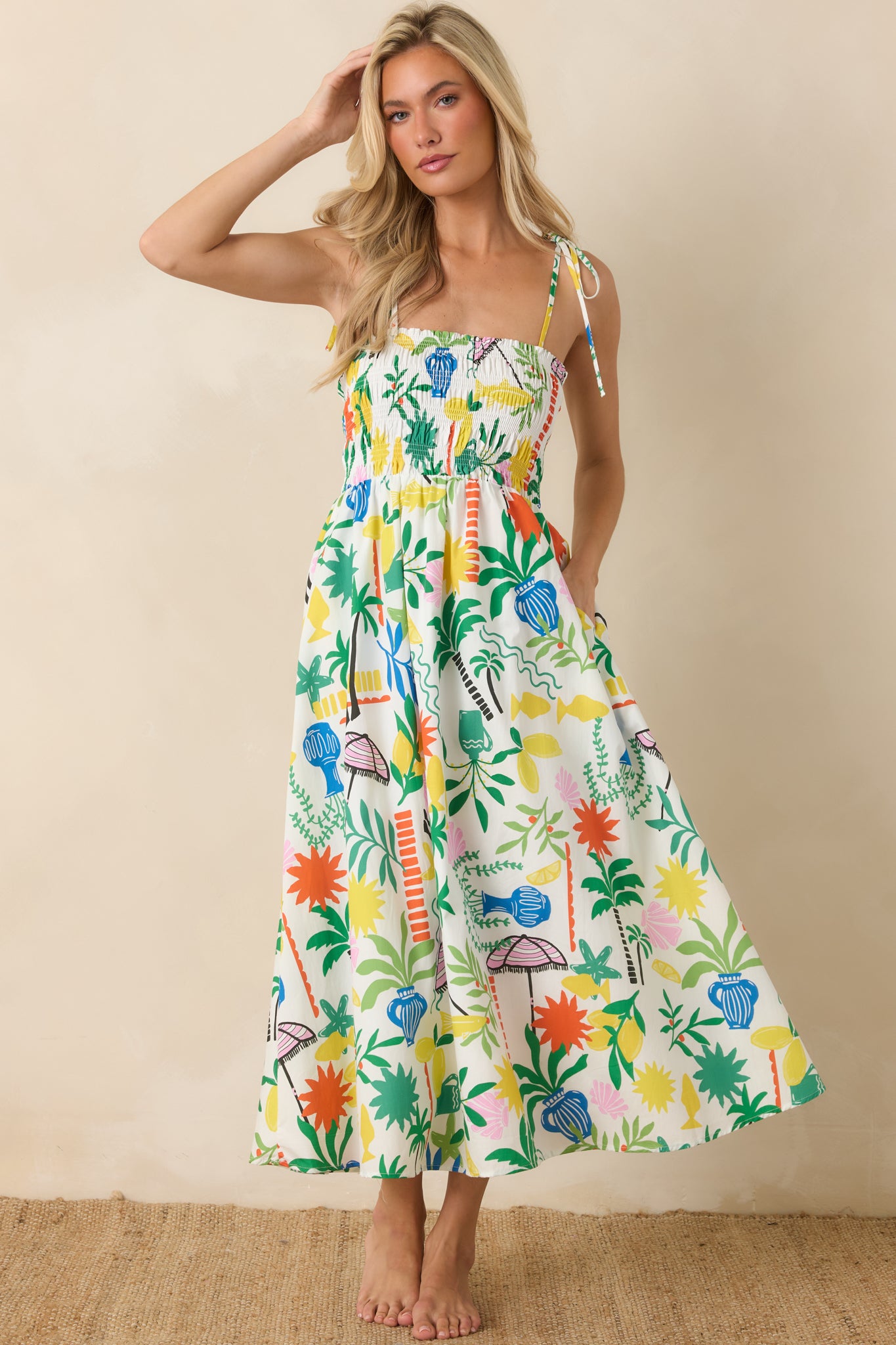 Lightweight cotton midi dress with a fitted smocked top, gathered waist, and full midi-length skirt with soft movement.