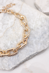 Detailed shot necklace that features large gold chain link pattern and measures 10