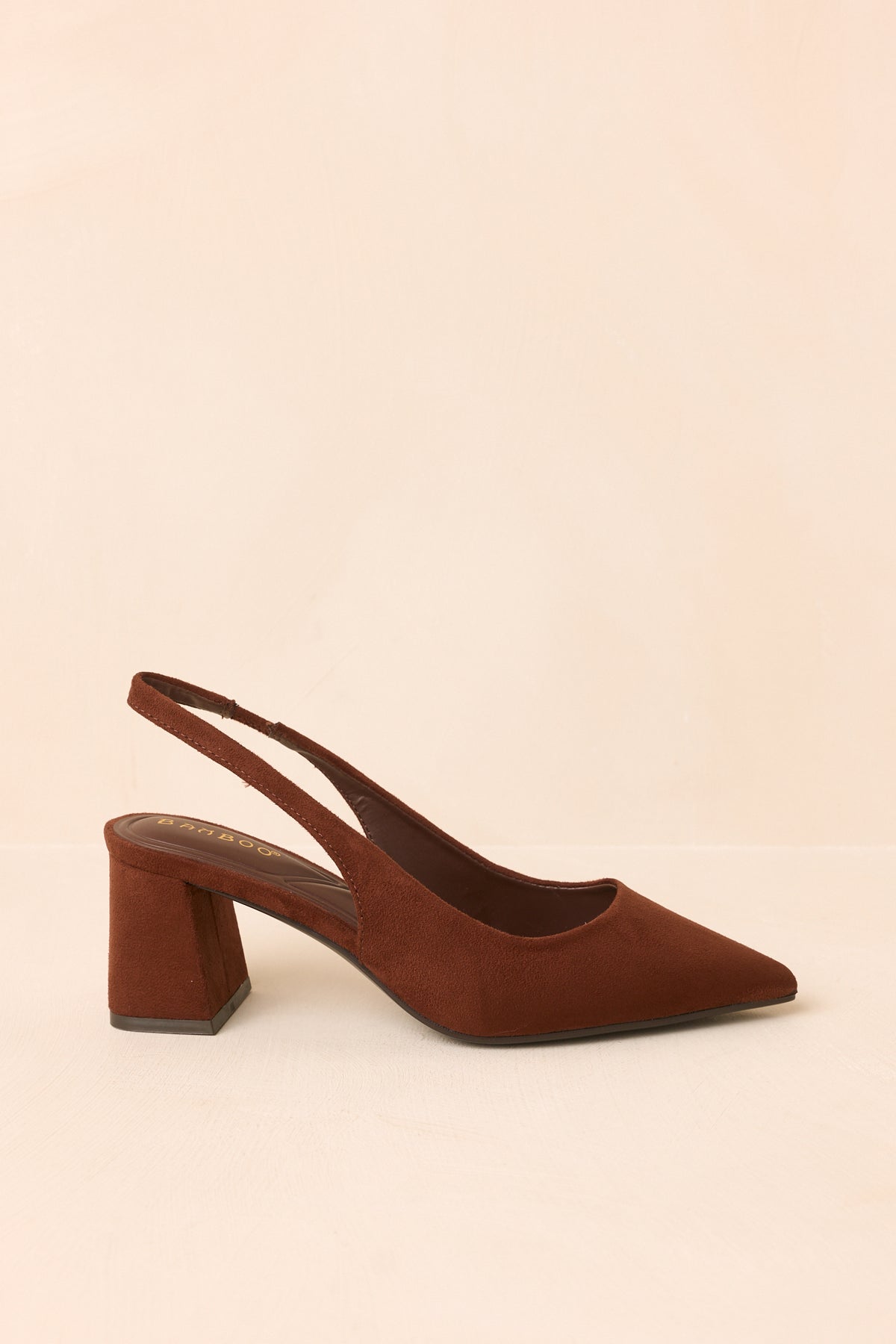 Warm brown faux suede slingback heels shown from the side, highlighting the pointed toe and covered block heel.