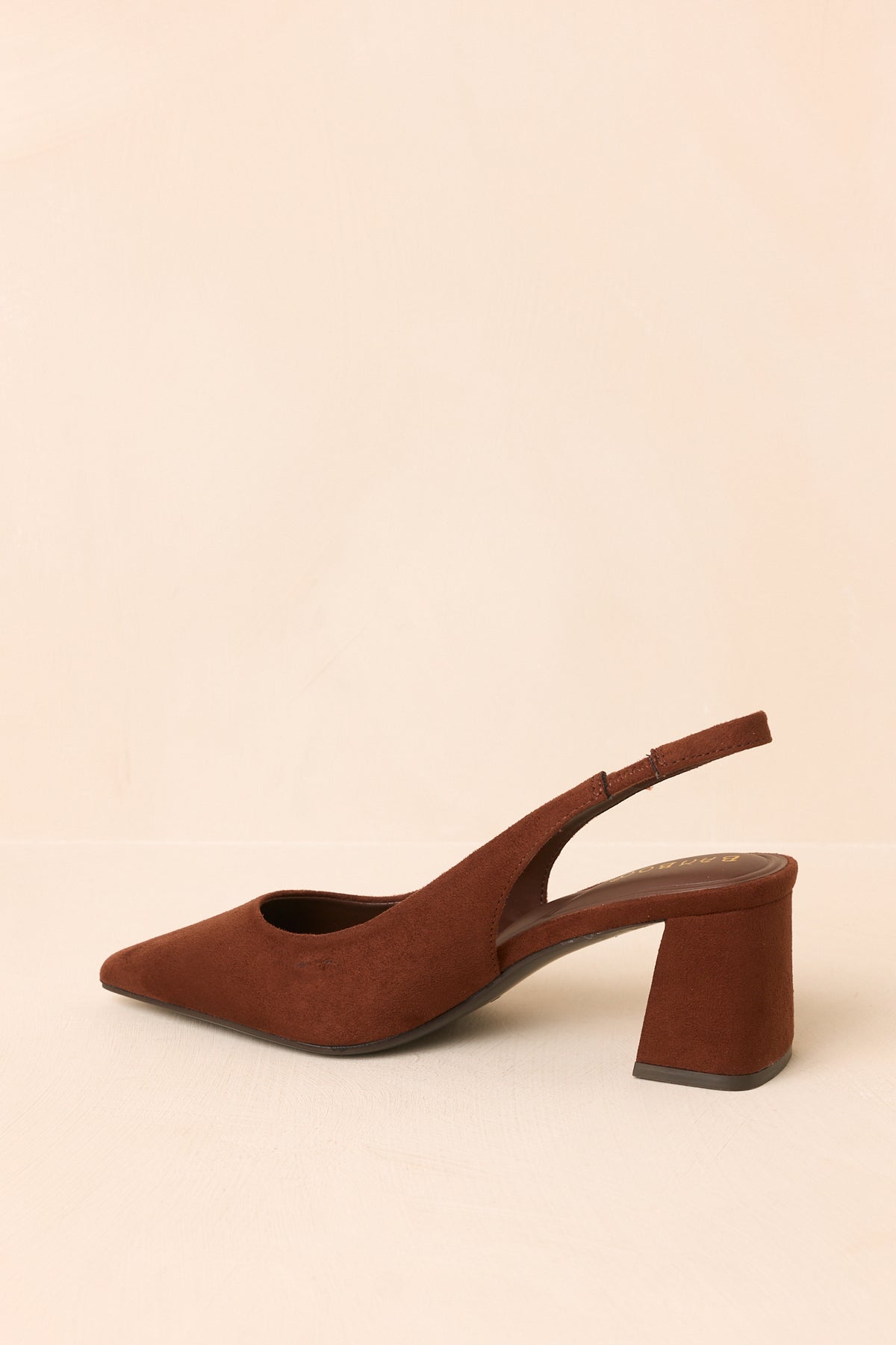 Brown faux suede slingback heels shown from another angle, emphasizing the substantial block heel and open back.