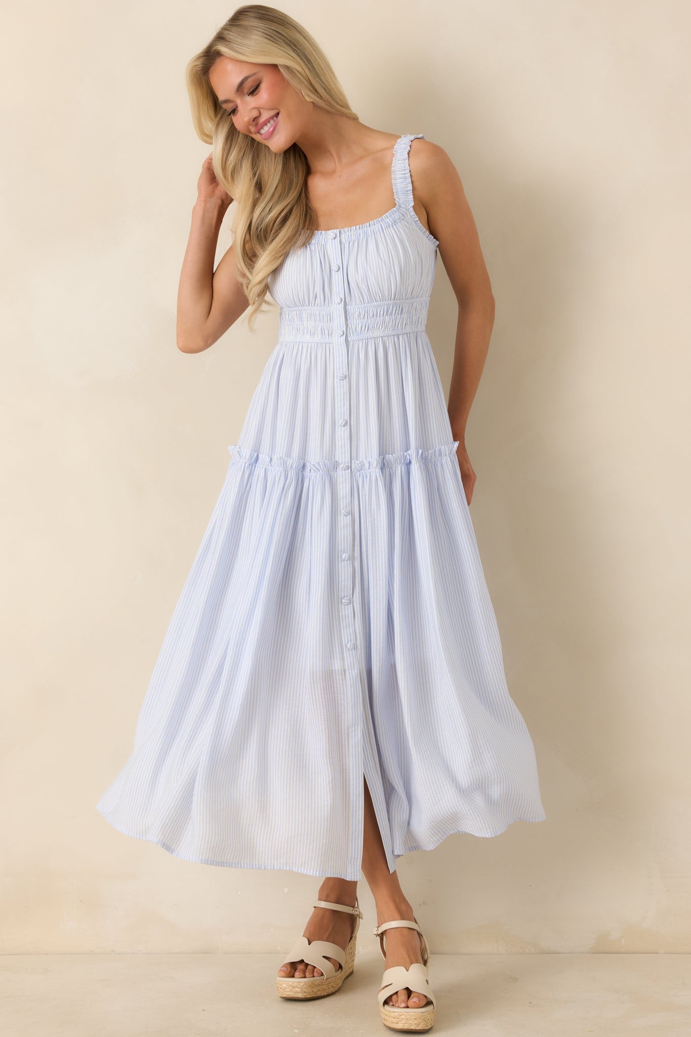 Pinstripe tiered dress with smocked waist, ruffled straps, and soft flowing layers with a vintage-inspired feel.
