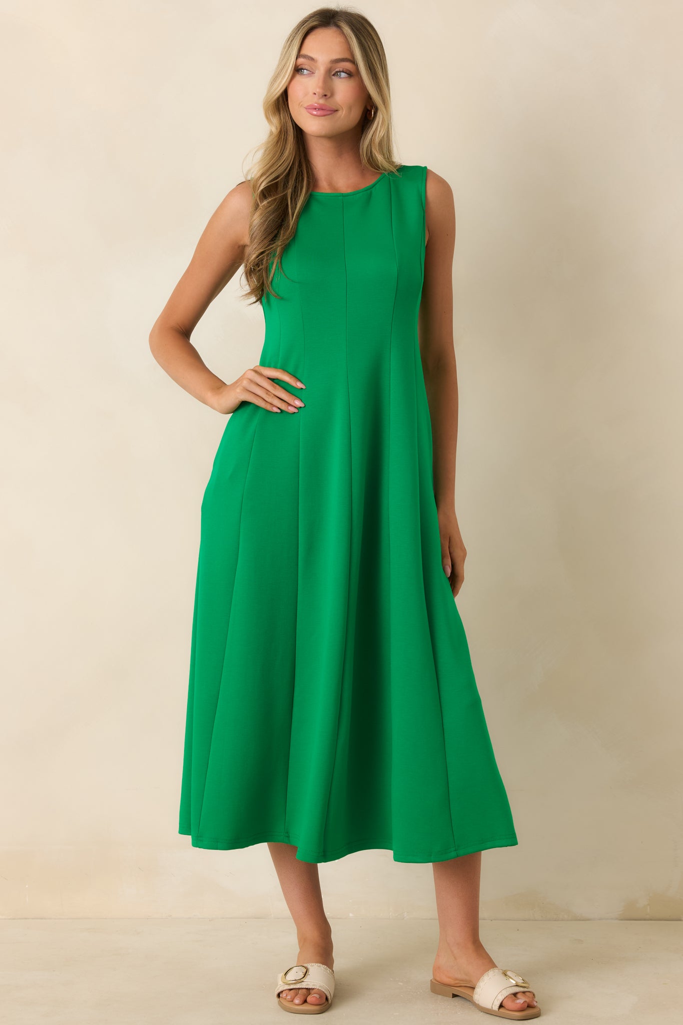 Classic green midi dress with a round neckline and ultra-soft stretchy fabric that falls into a graceful full-length shape.