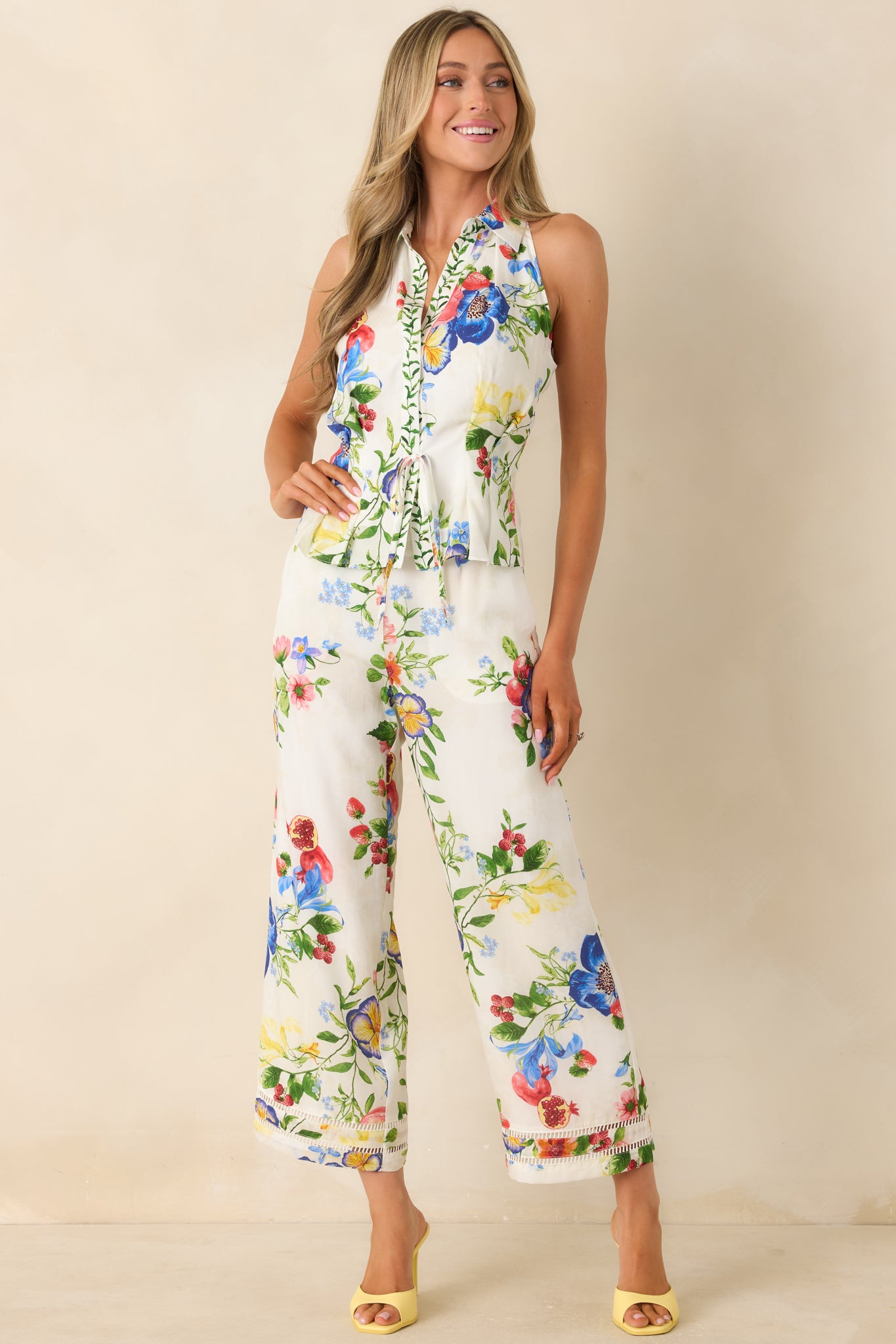 Lightweight lyocell-linen blend top featuring vibrant floral print and flattering halter shape.