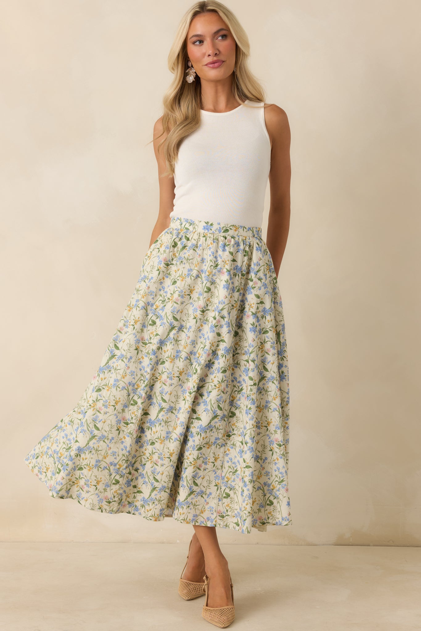 Cotton floral midi skirt featuring a gathered waistband and relaxed A-line fit with a soft multicolor print throughout.