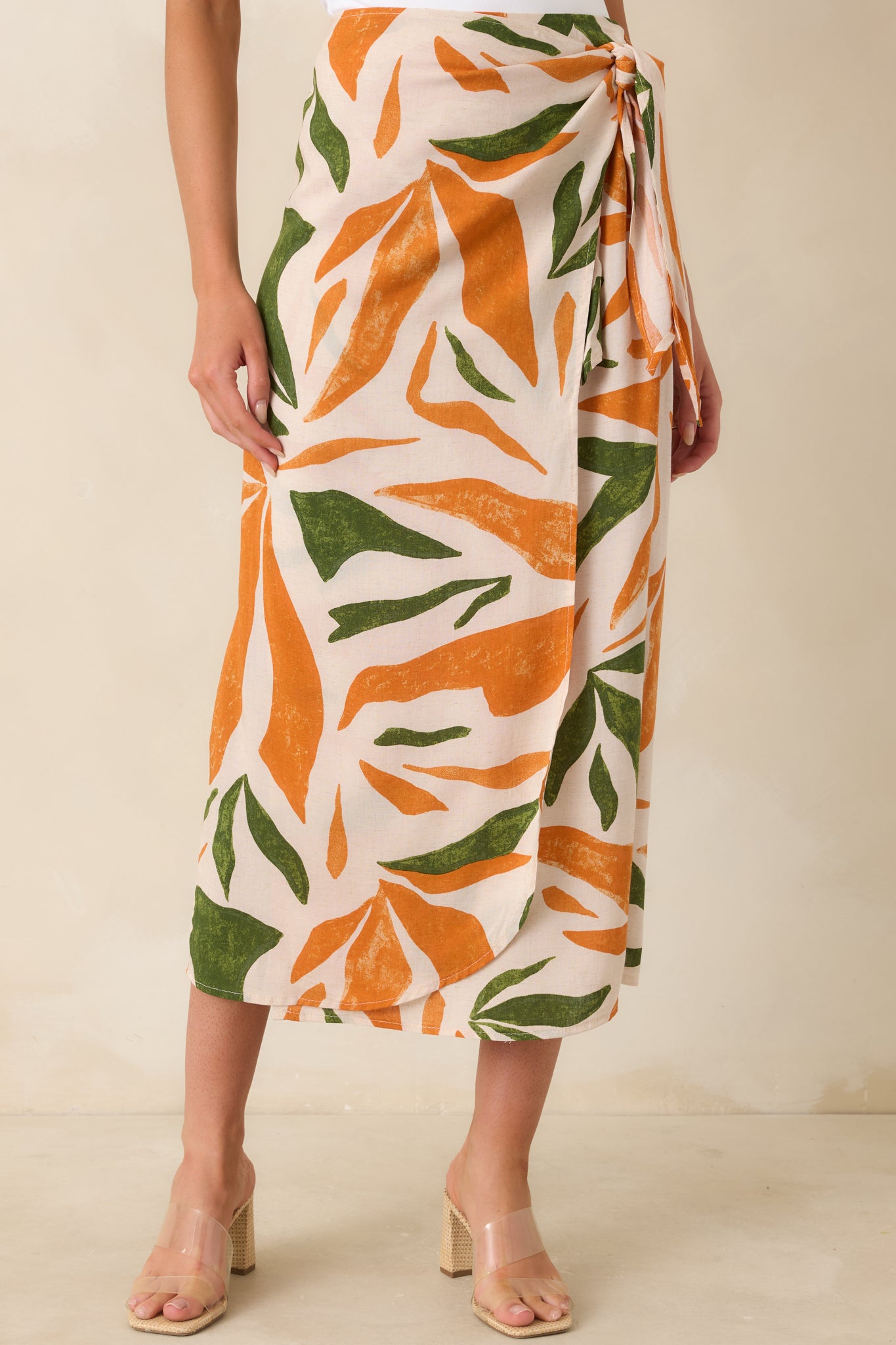 Close view of tropical midi skirt with elastic waist insert and vivid print.