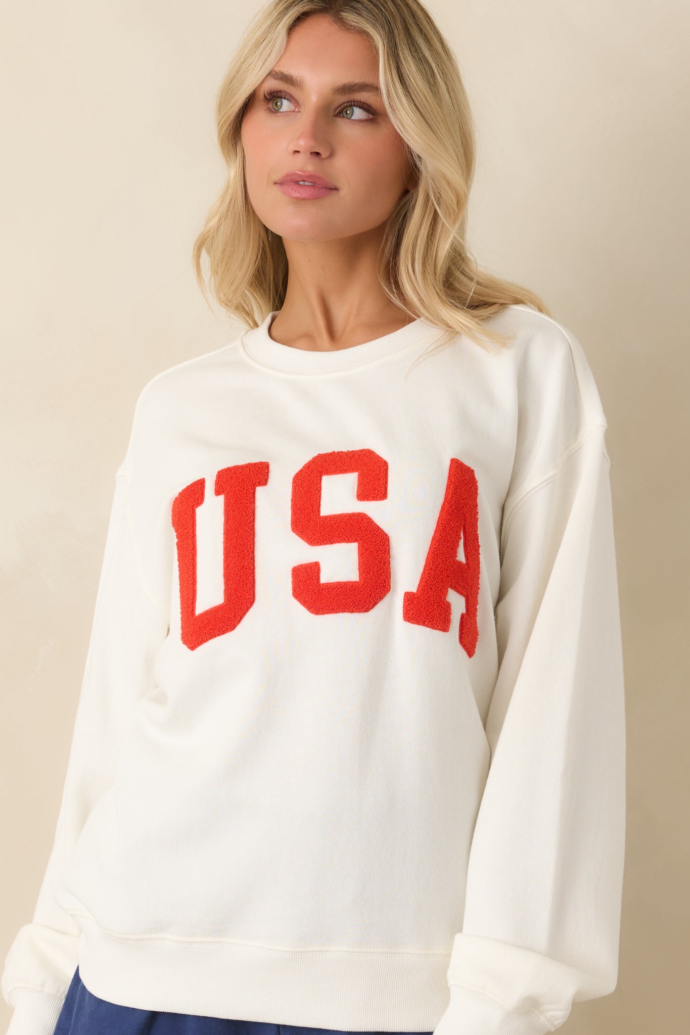 Upper front detail highlighting the placement of the “USA” lettering beneath the neckline on the lightweight knit surface.