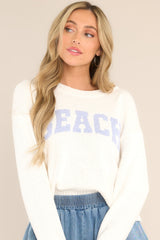 Front view of  this sweater that features a ribbed crew neckline and varsity style wording across the chest.