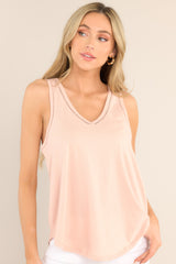 Front view of this top that features a v-neckline and transparent detailing.