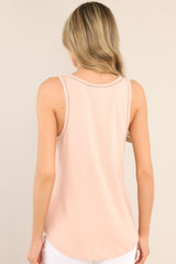 Back view of this top that features a v-neckline, transparent detailing, and a soft & lightweight material.