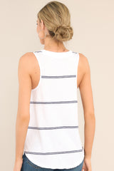Back view of this top that features a v-neckline, a scoop bottom hem, raw hemmed edges, and a light, breathable fabric.